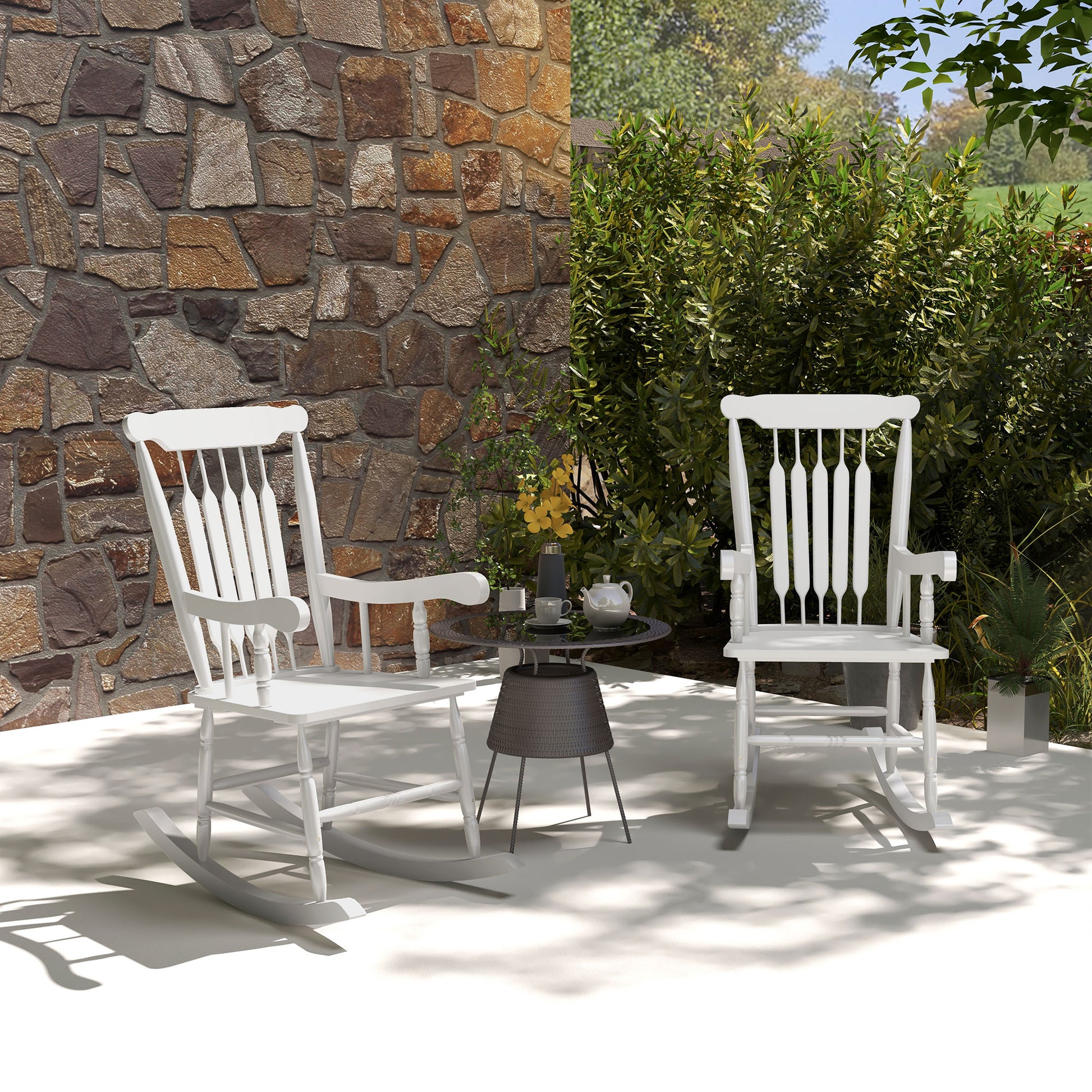 White wooden rocking chair with classic spindle back perfect for garden relaxation