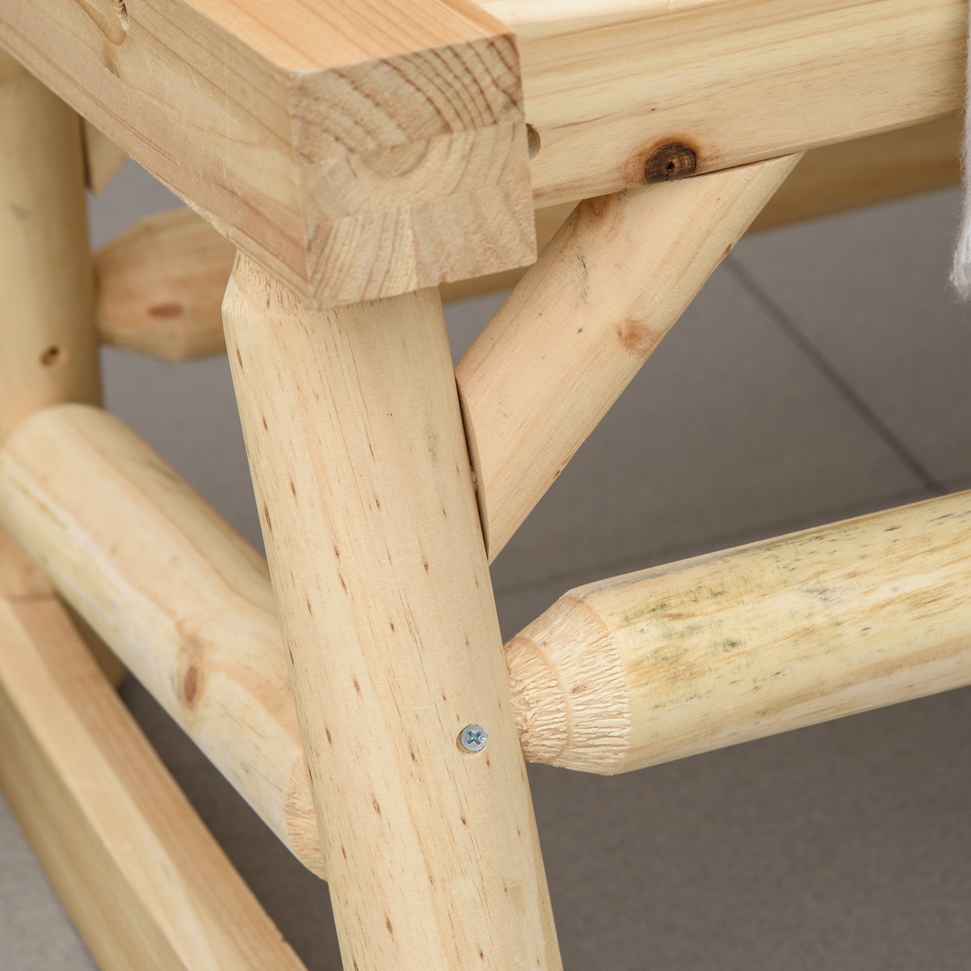 Closeup of a sturdy wooden chair frame showcasing natural pine wood joinery and texture