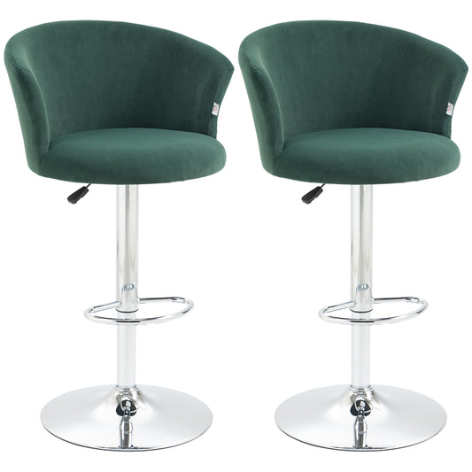 Two plush green velvet bar stools with chrome bases and adjustable height