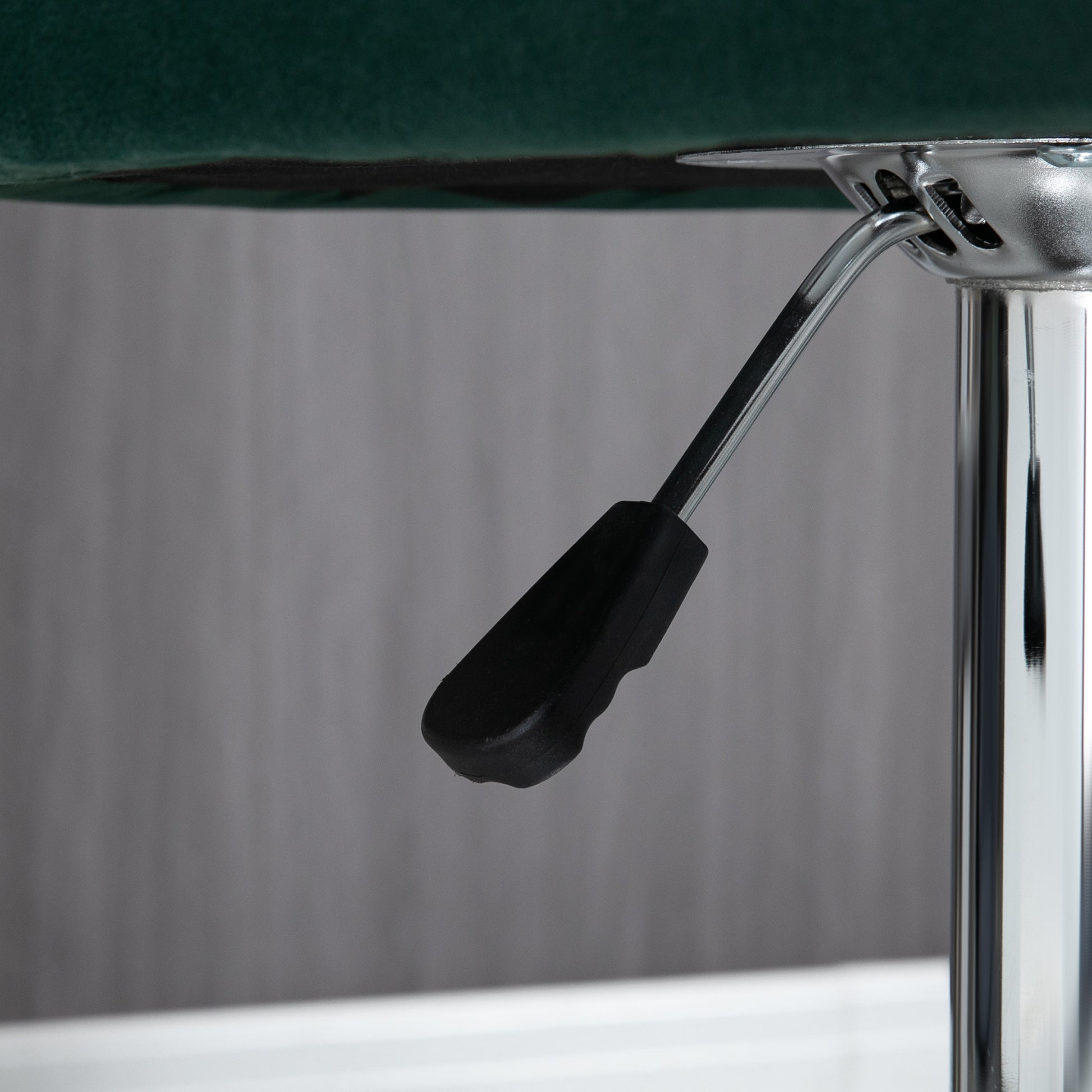 Adjustable lever on a chrome gas lift bar for a bar stool