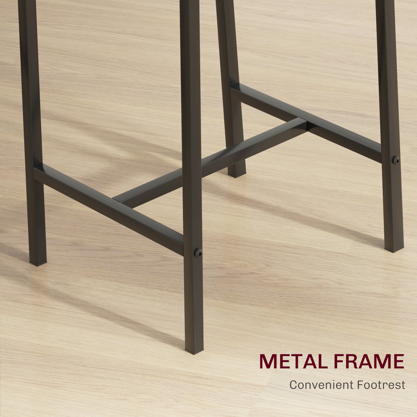 Dark gray metal frame and footrest detail on a light wood floor