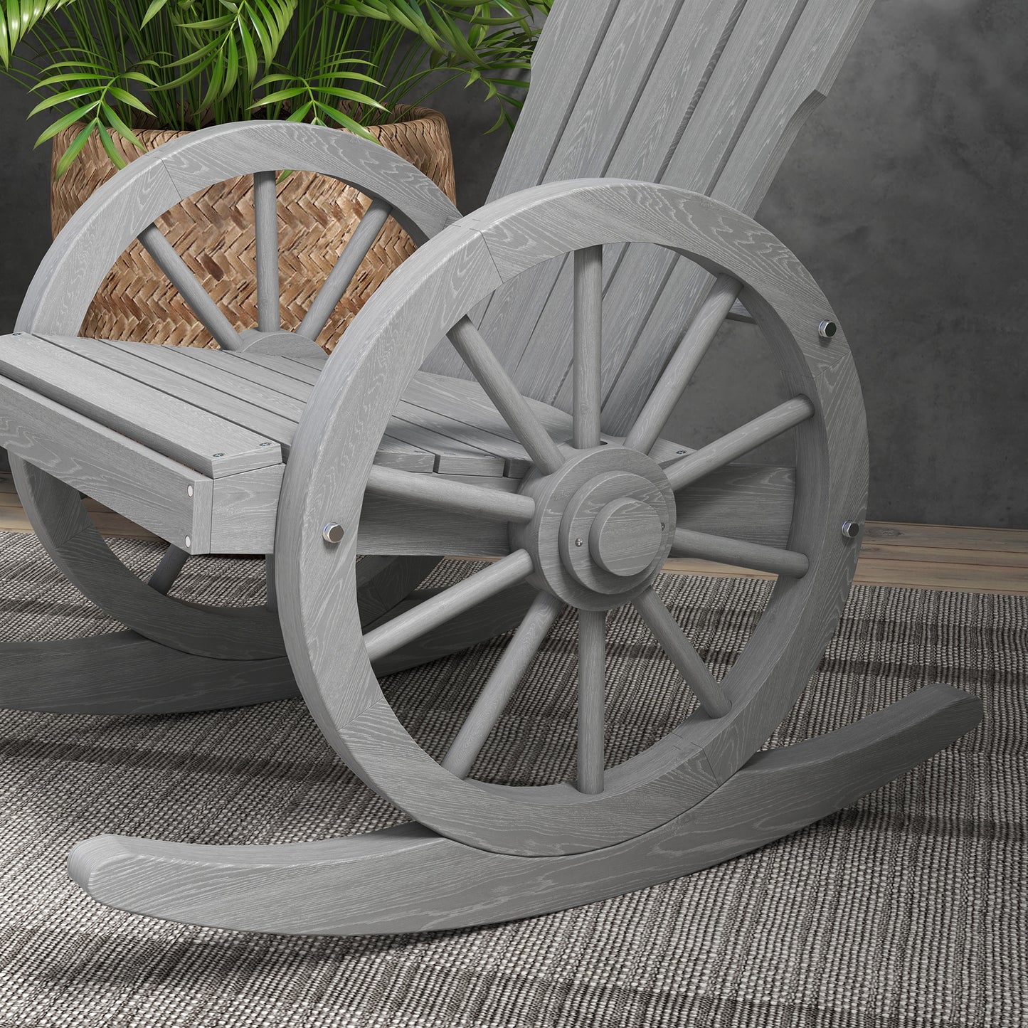 Gray wooden rocking chair with wagon wheel accents perfect for rustic patio decor