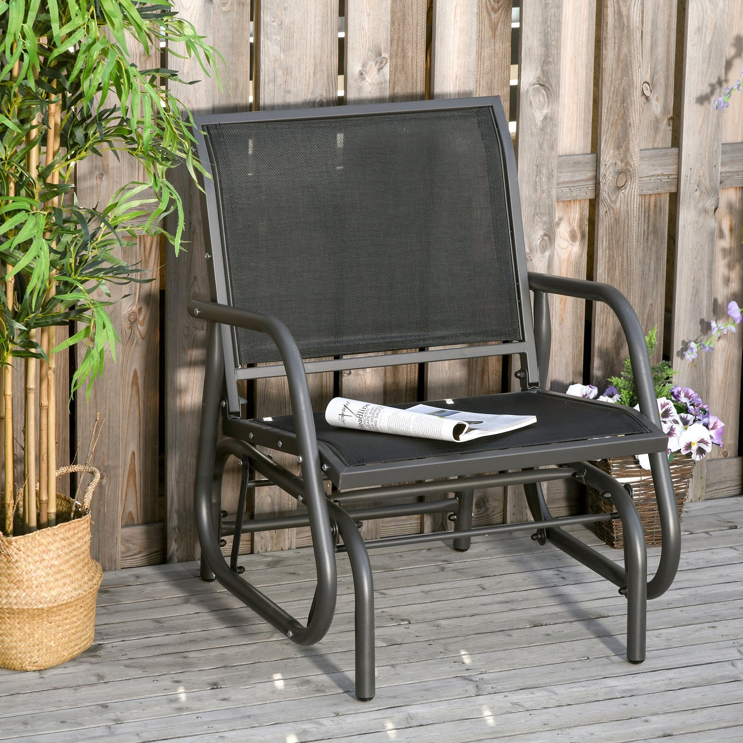 Dark grey metal outdoor glider chair with mesh seat and backrest relaxed seating