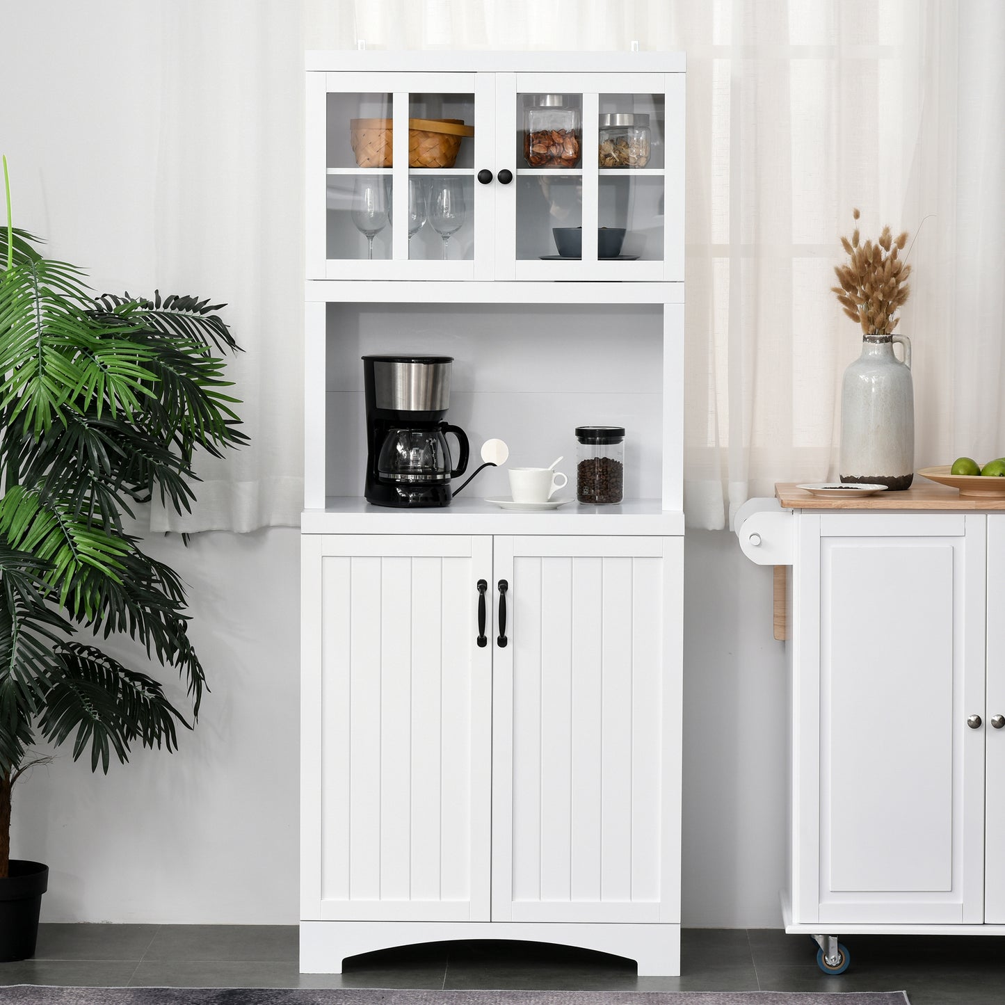 White kitchen pantry with glassdoor upper cabinets and wood accent countertop
