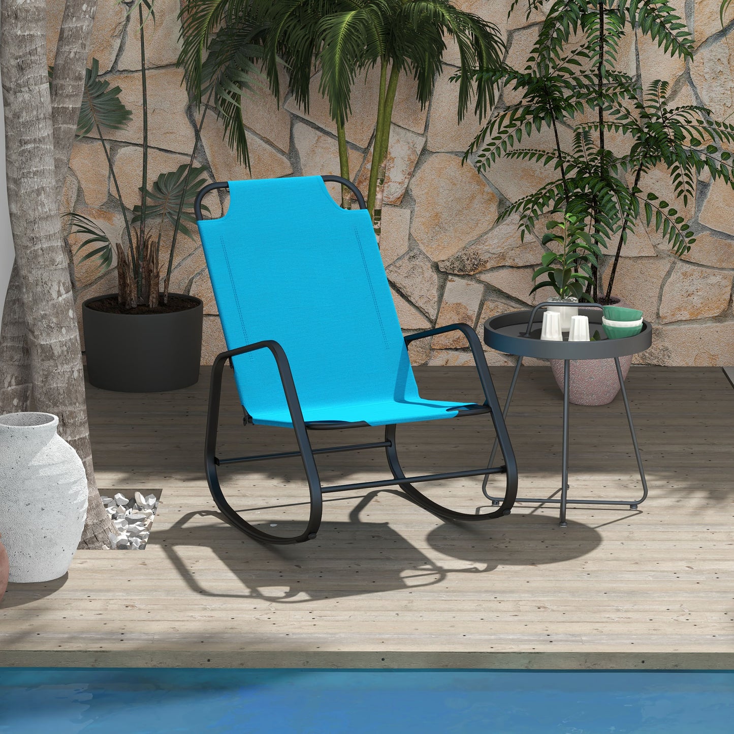 Bright blue fabric rocking chair with black metal frame on a wooden deck