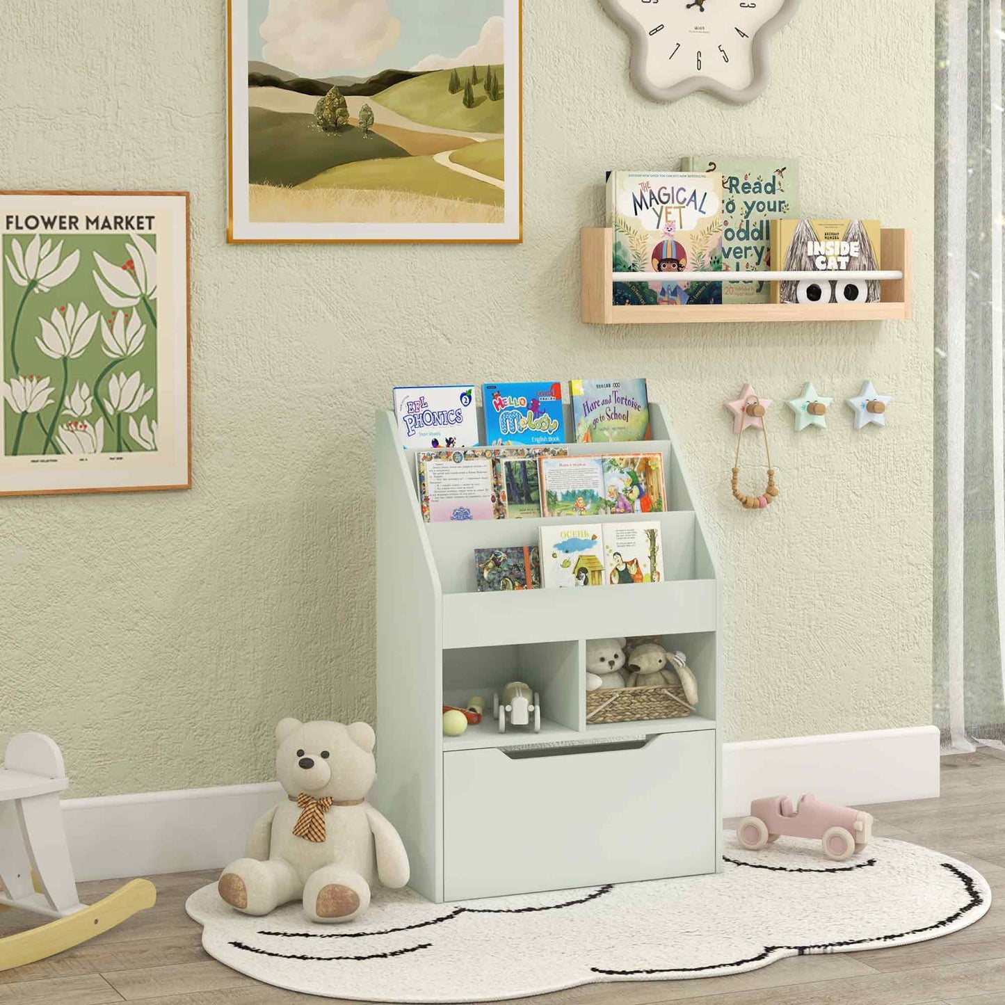 Light blue toddler bookshelf with open shelves displaying childrens books and toys