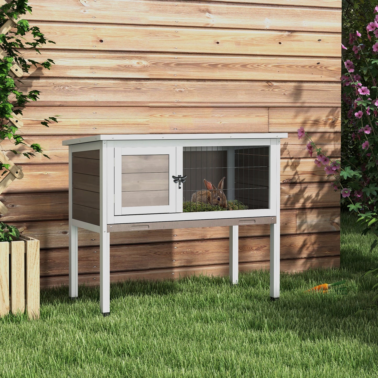 Twotier rabbit hutch with wooden panels and wire mesh enclosure