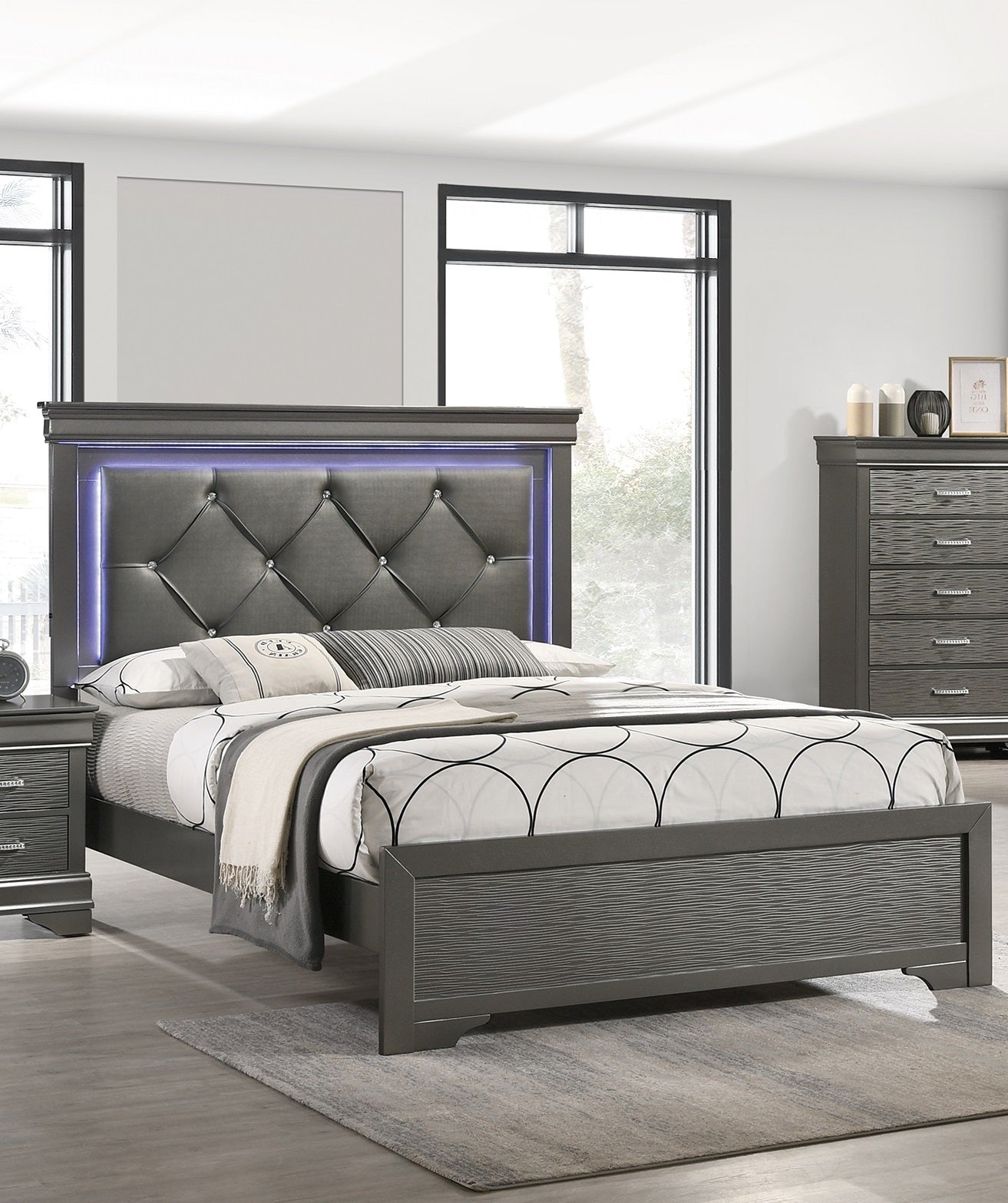 Upholstered grey headboard bed frame with diamond tufting and integrated LED lighting