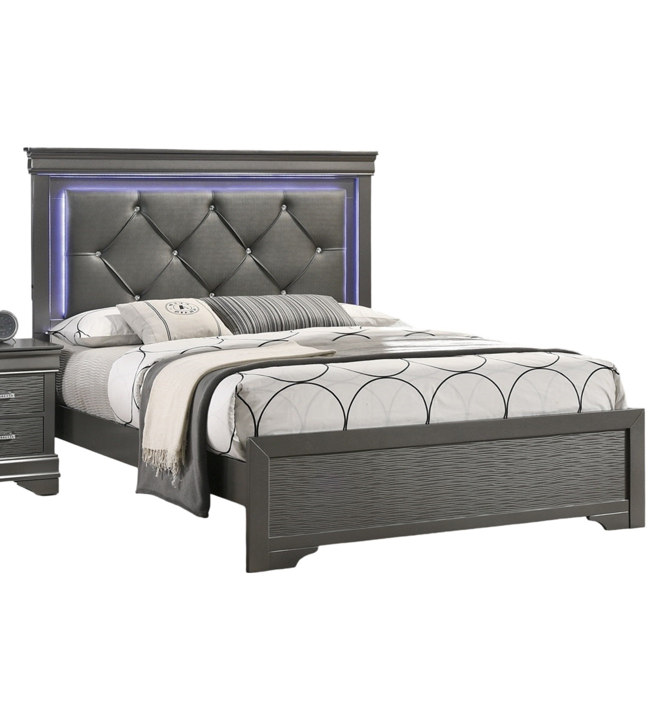 Gray upholstered king bed with diamond tufting and LED headboard