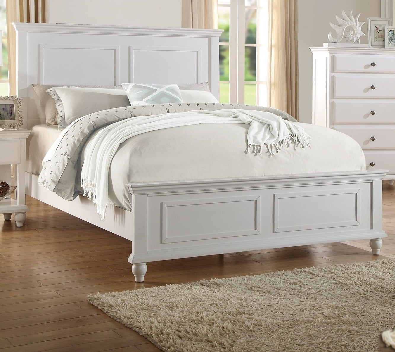White paneled king bed frame with upholstered headboard ideal for a master bedroom