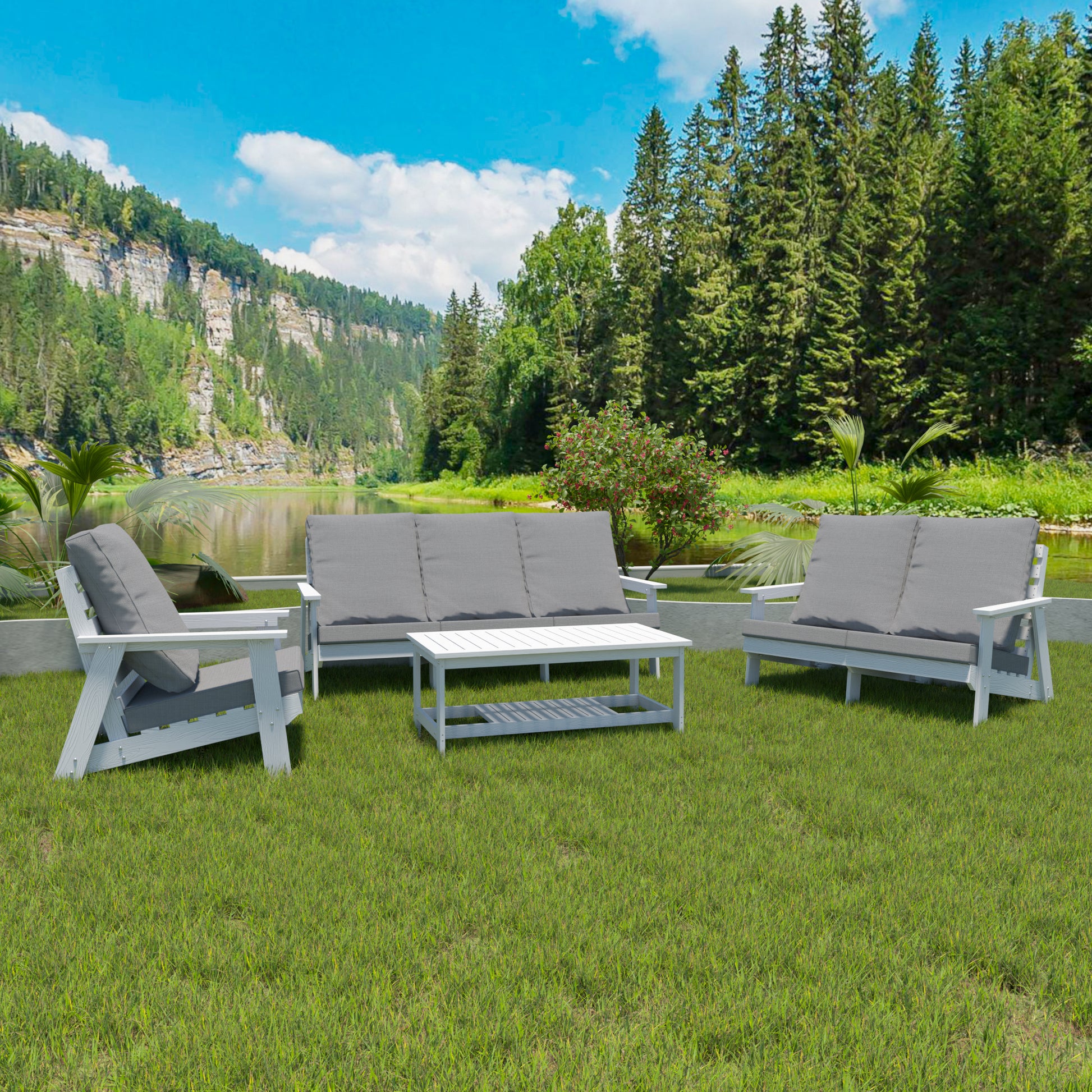 White wood outdoor furniture set with grey cushions on green lawn by a lake