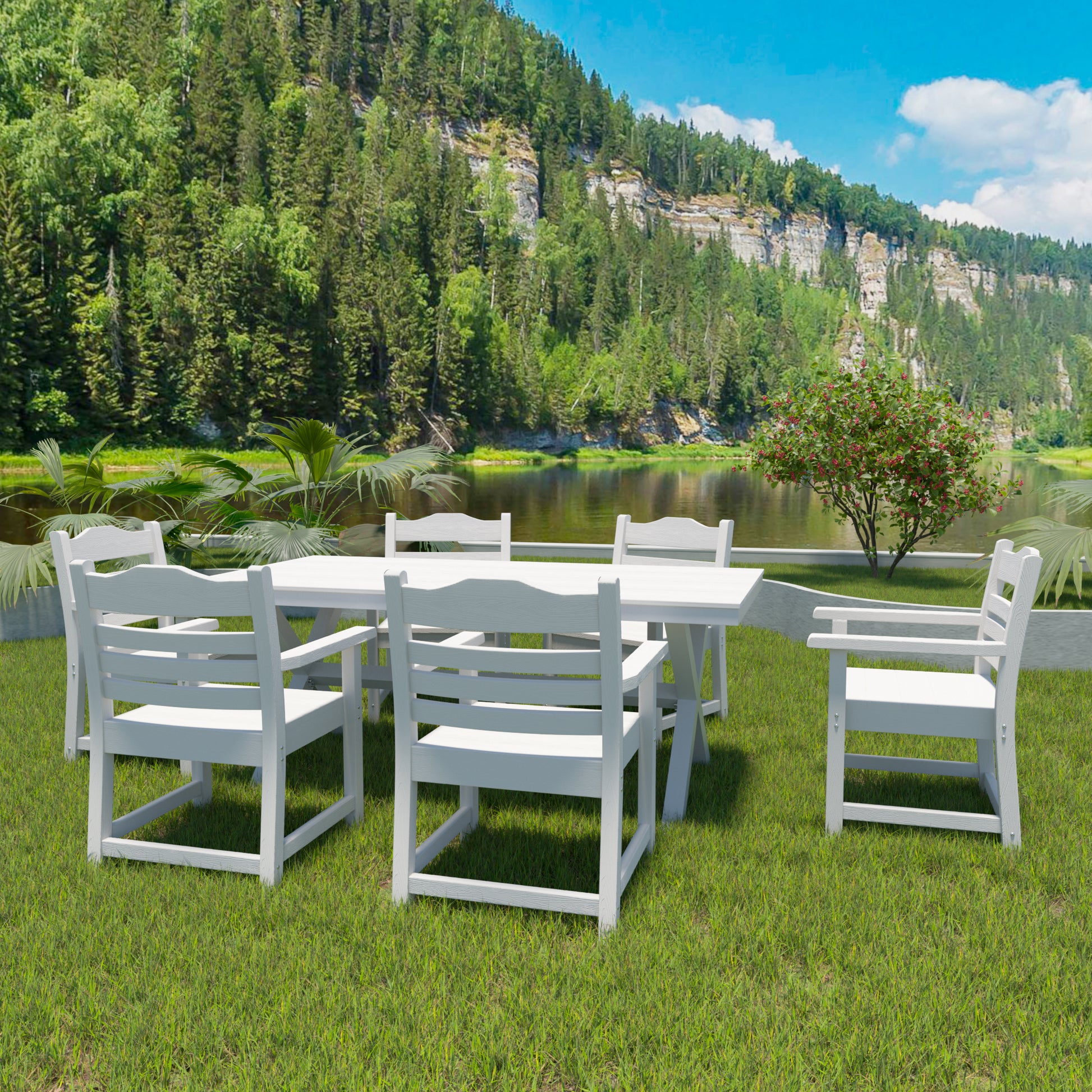 White wooden dining set with six chairs on lush green grass by a serene lake