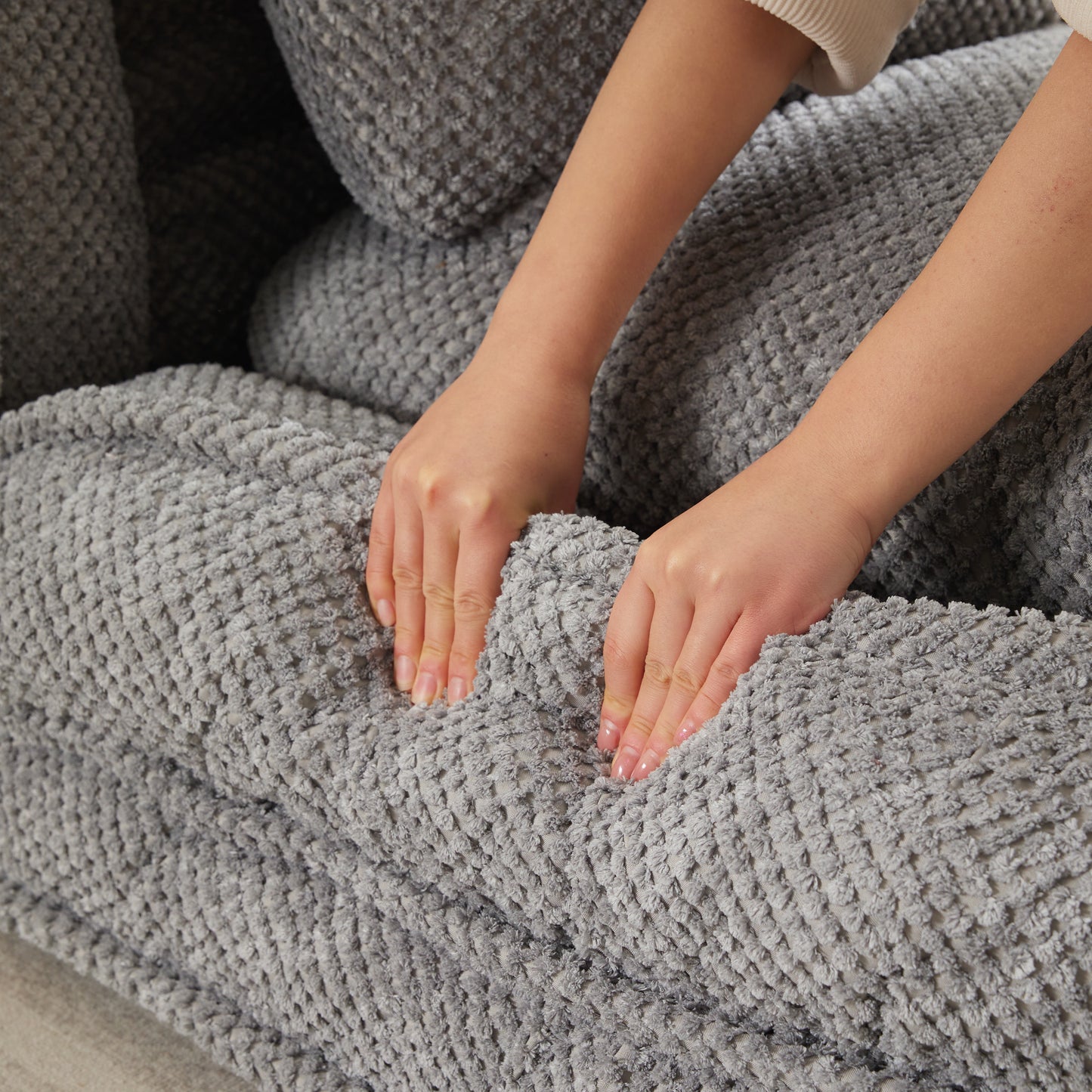 Closeup of plush grey textured fabric showing softness and comfort