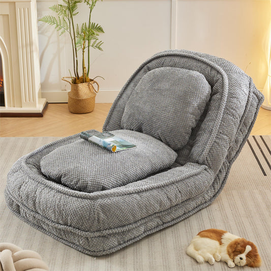 Plush grey floor chair with adjustable backrest and textured fabric for ultimate comfort