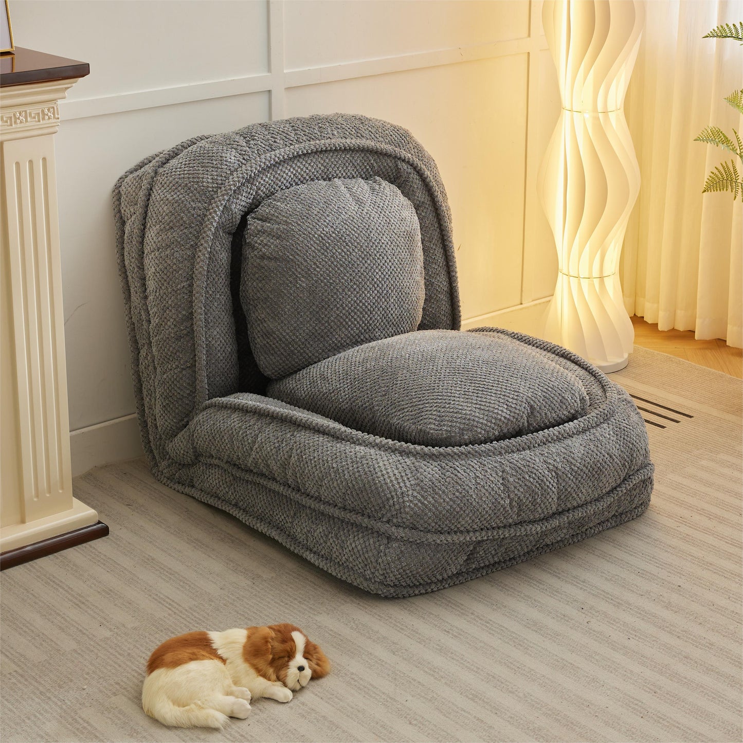 Plush grey floor chair with adjustable back perfect for reading nooks