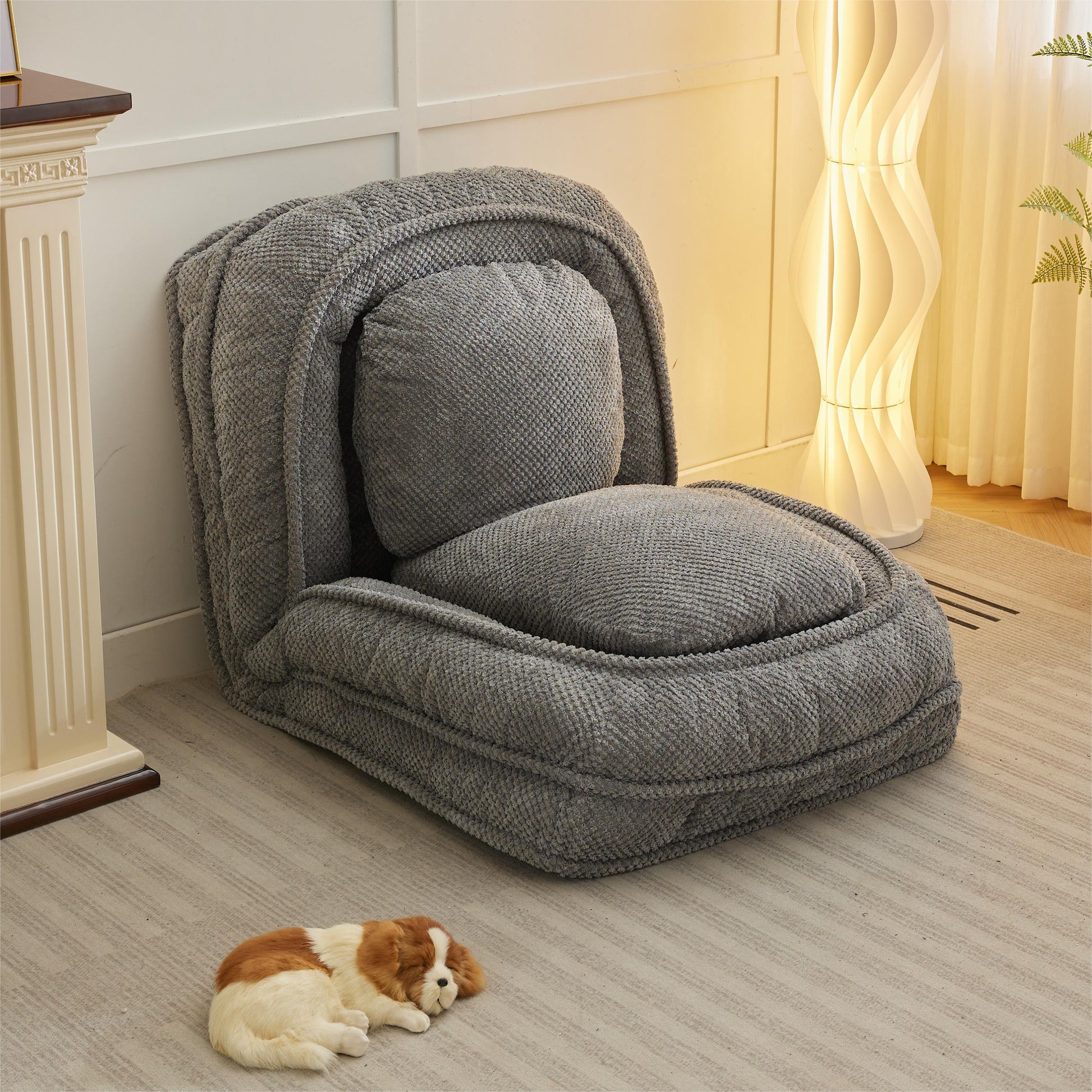 Plush grey floor chair with adjustable back perfect for reading nooks