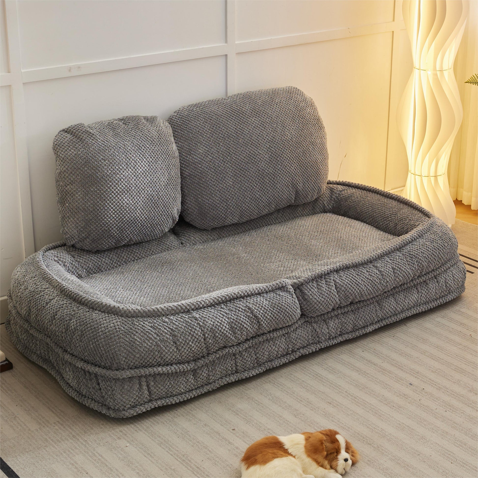Plush grey dog bed with raised bolsters for comfort and security