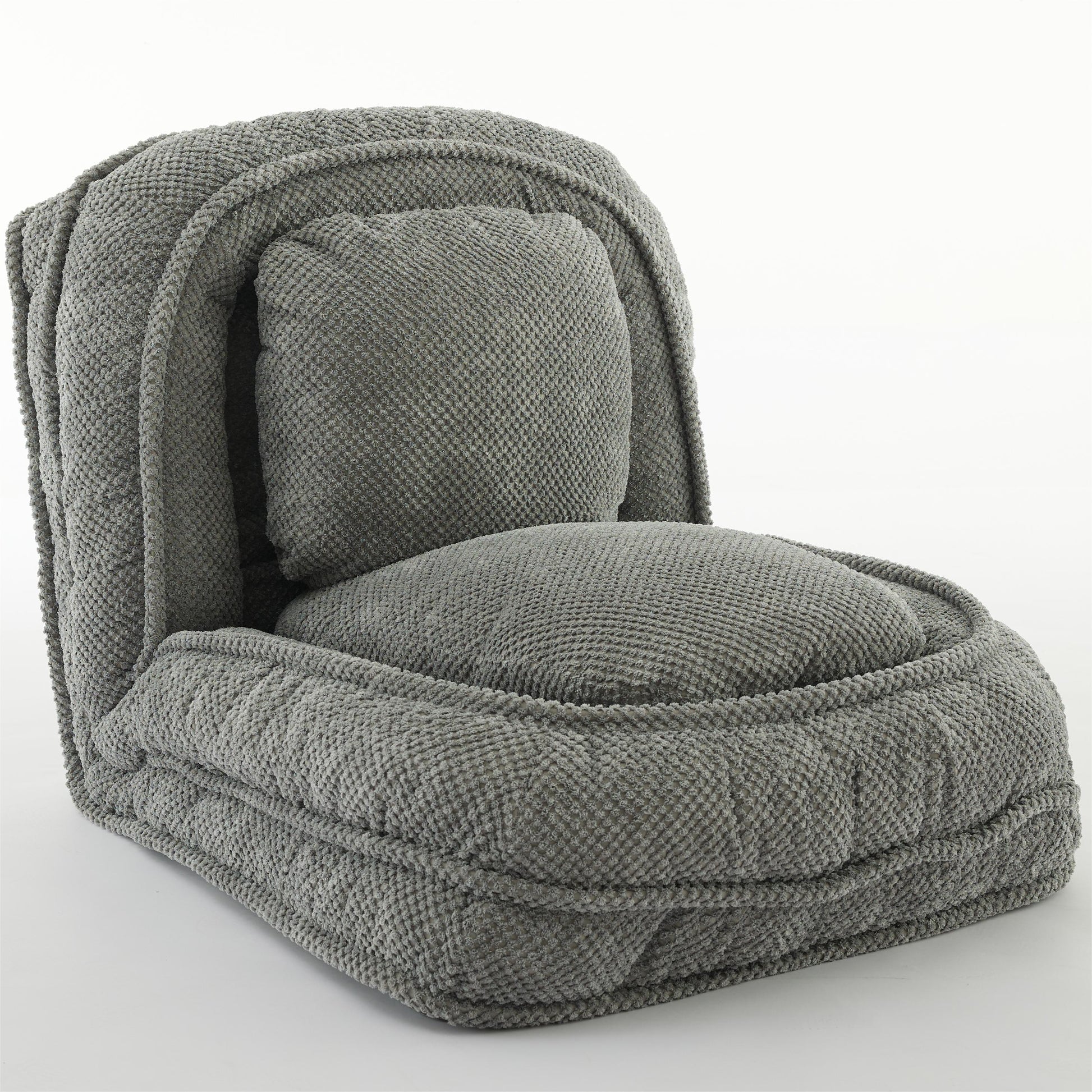 Plush grey fabric floor chair with rounded edges and a removable cushion for comfortable lounging