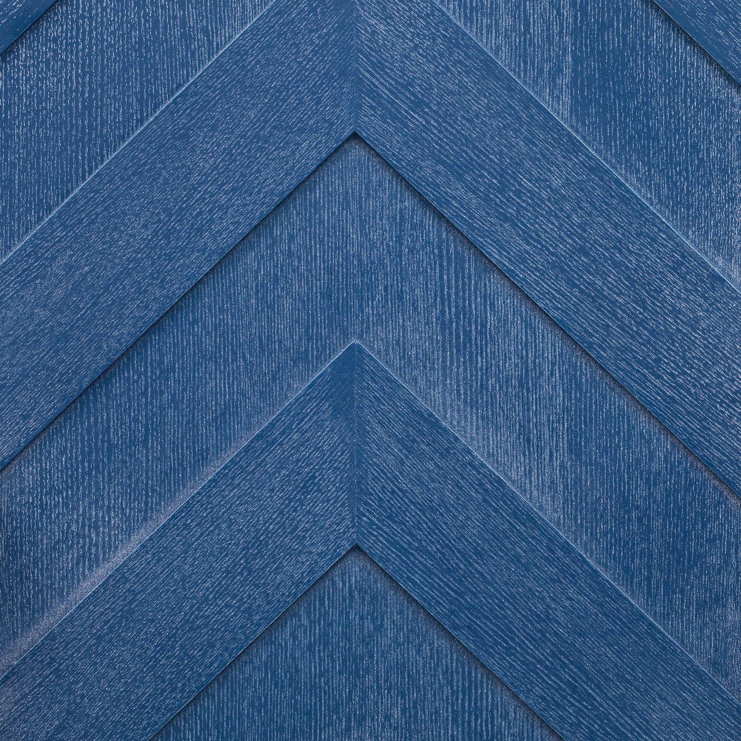 Deep blue wood paneling with a chevron pattern
