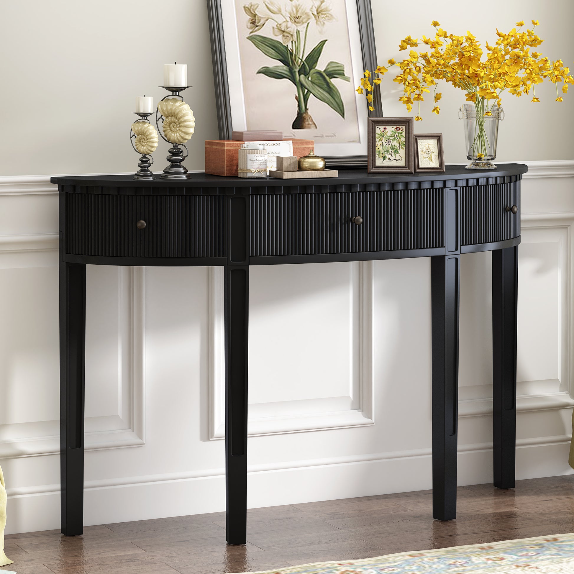 Elegant black console table with fluted drawers and metal knobs