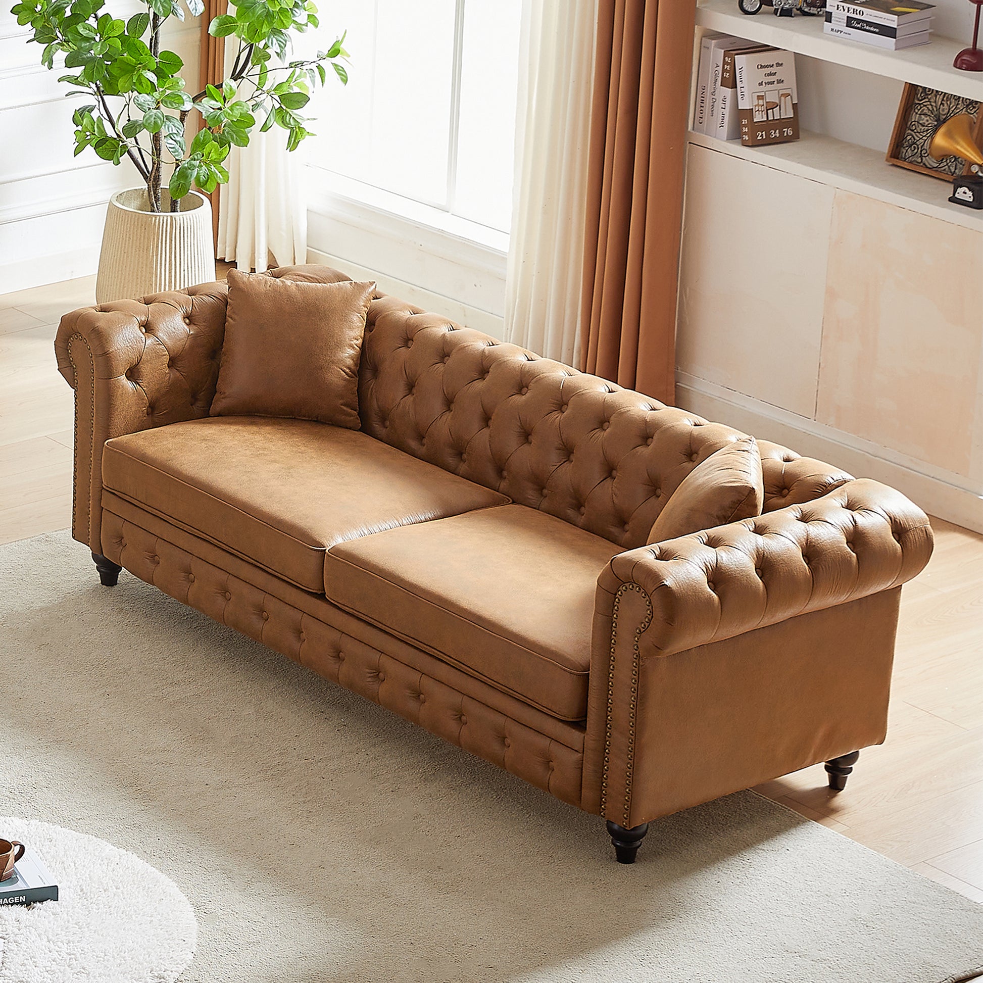 Brown leather tufted Chesterfield sofa with rolled arms and nailhead trim