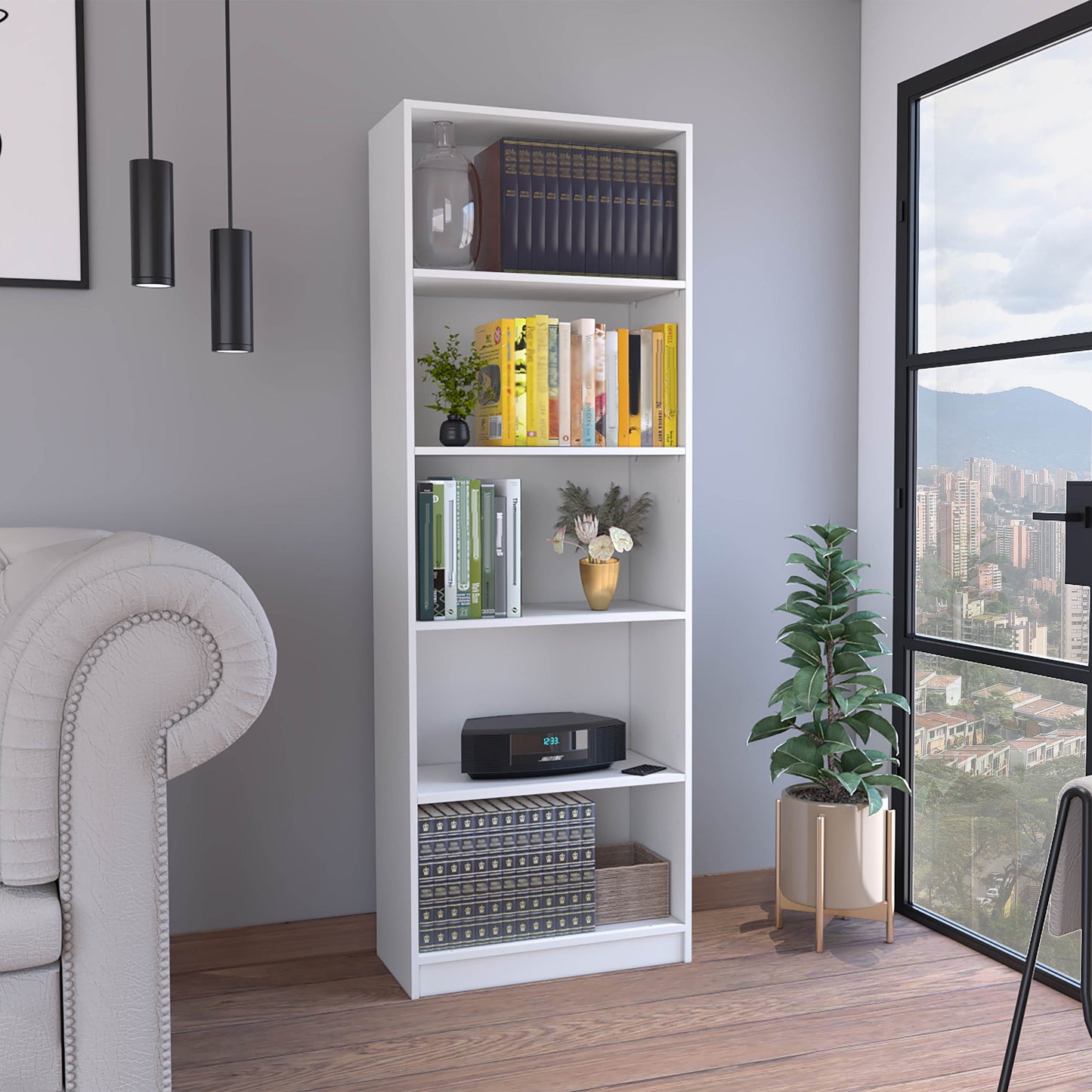 Tall white bookshelf with decorative books and a modern Bose radio on the lower shelf