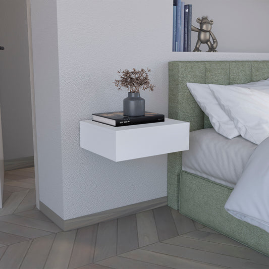 Minimalist white floating shelf with books and vase perfect for modern bedside tables