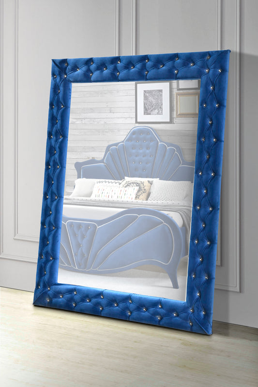 Blue velvet tufted mirror with silver crystal accents and a floorstanding design