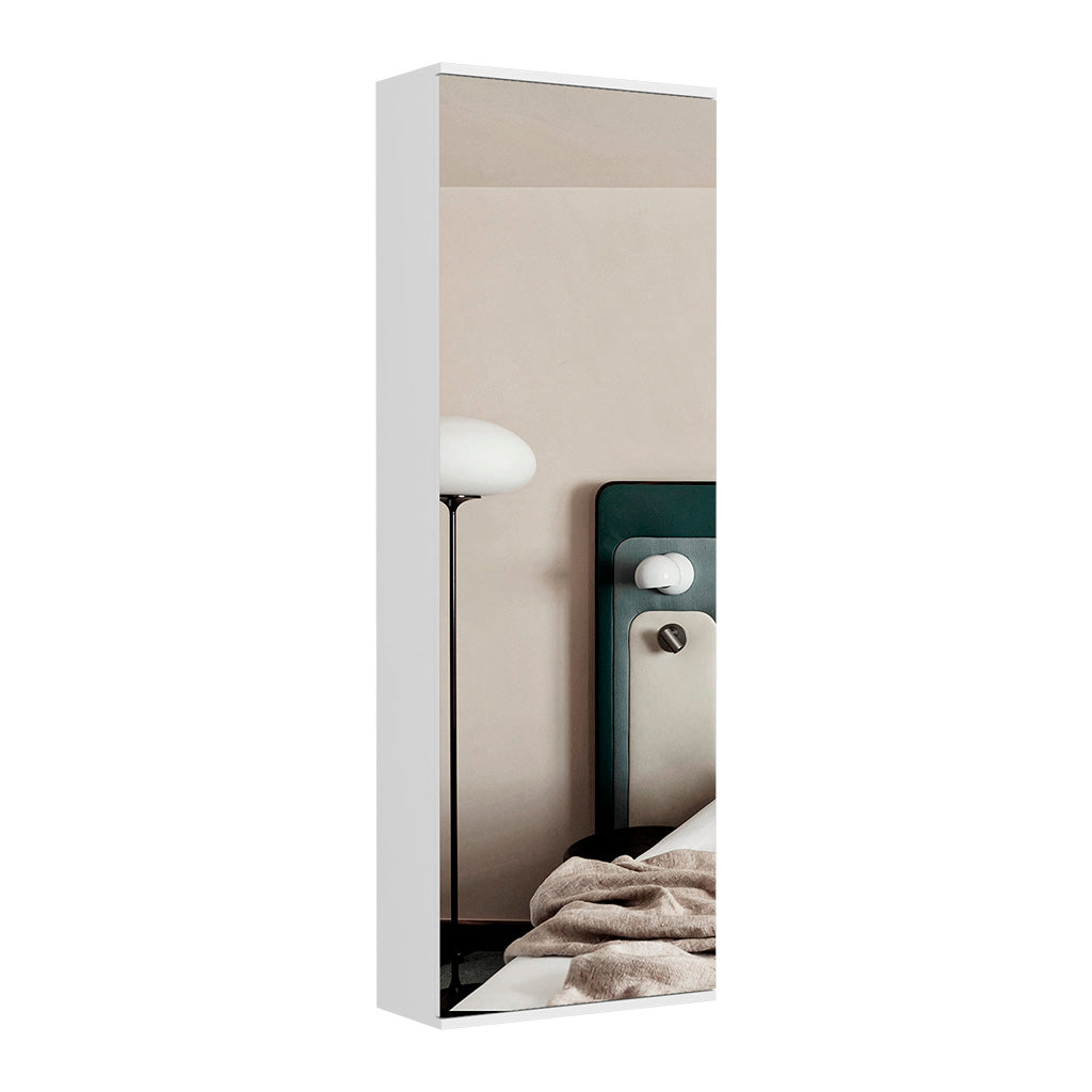 Fulllength white wardrobe door with integrated mirror reflecting a modern bedroom scene