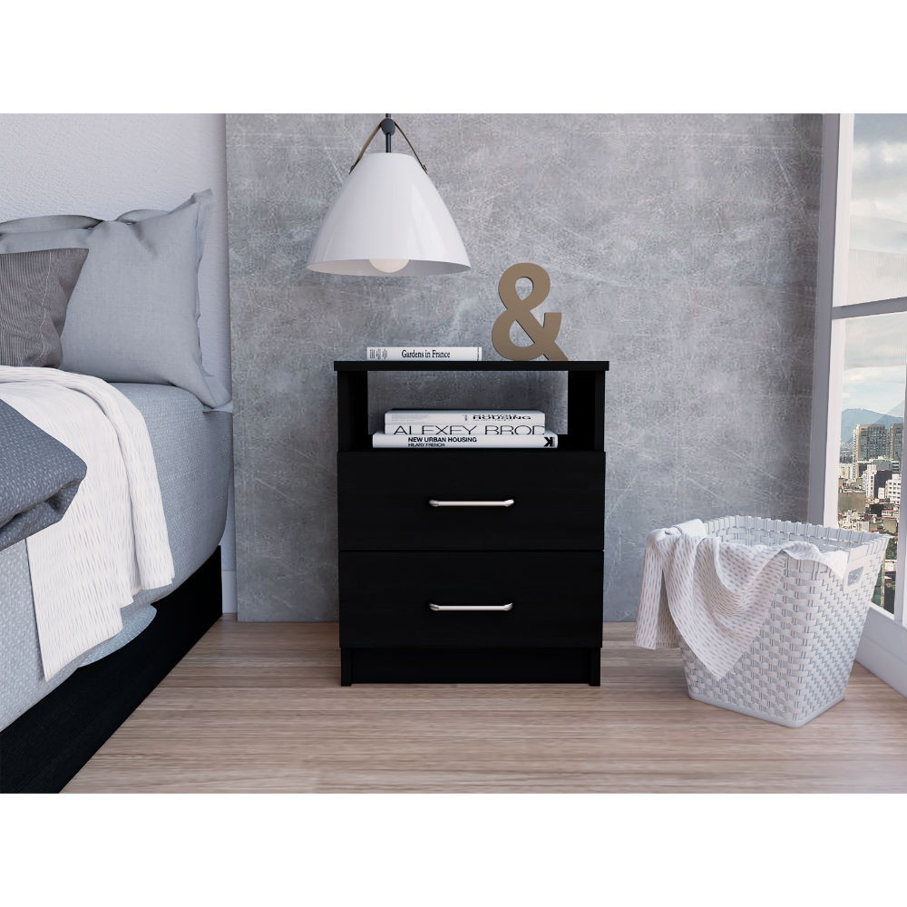 Black twodrawer nightstand with silver pulls holding decor books