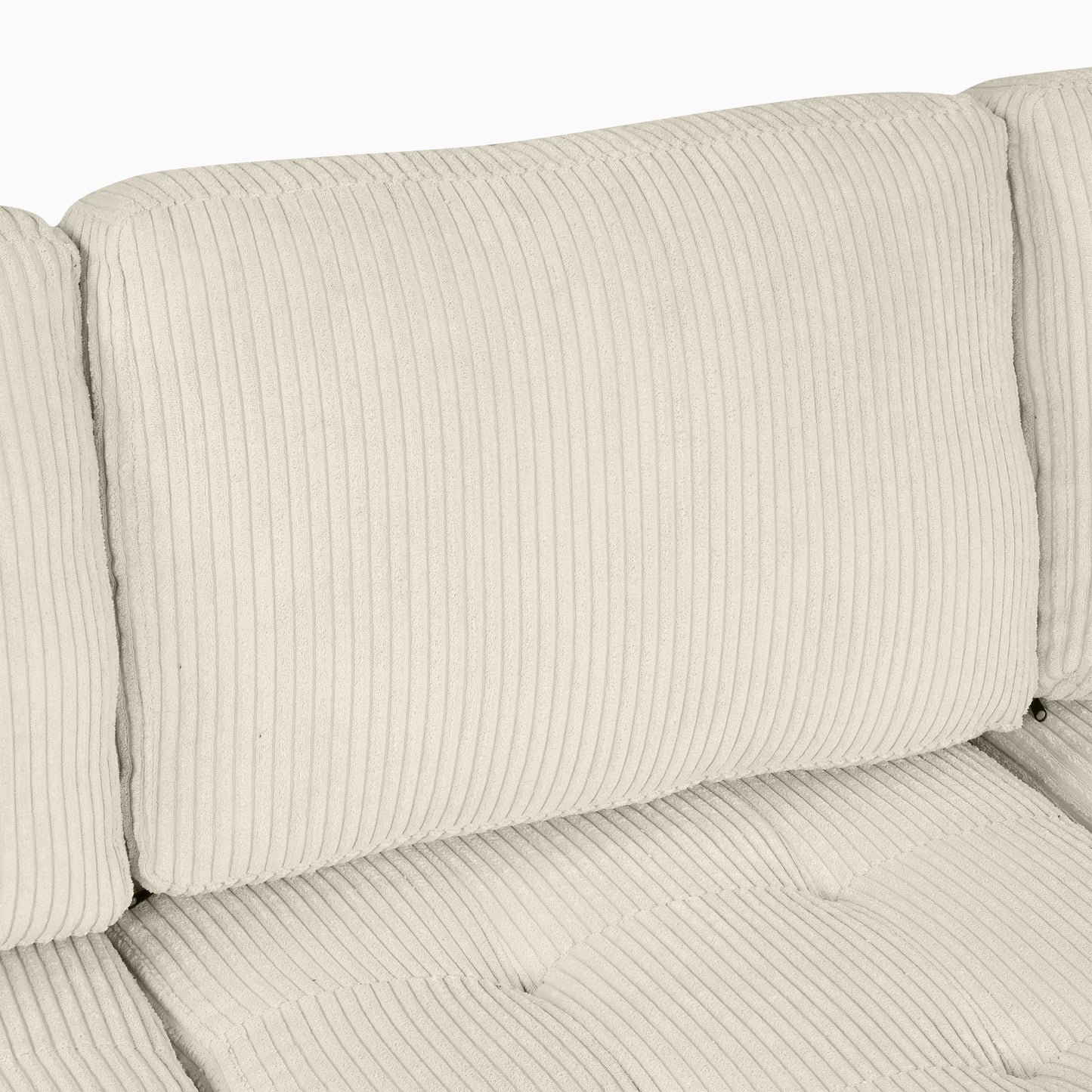 Closeup of plush ivory corduroy sofa cushion with vertical ribbing