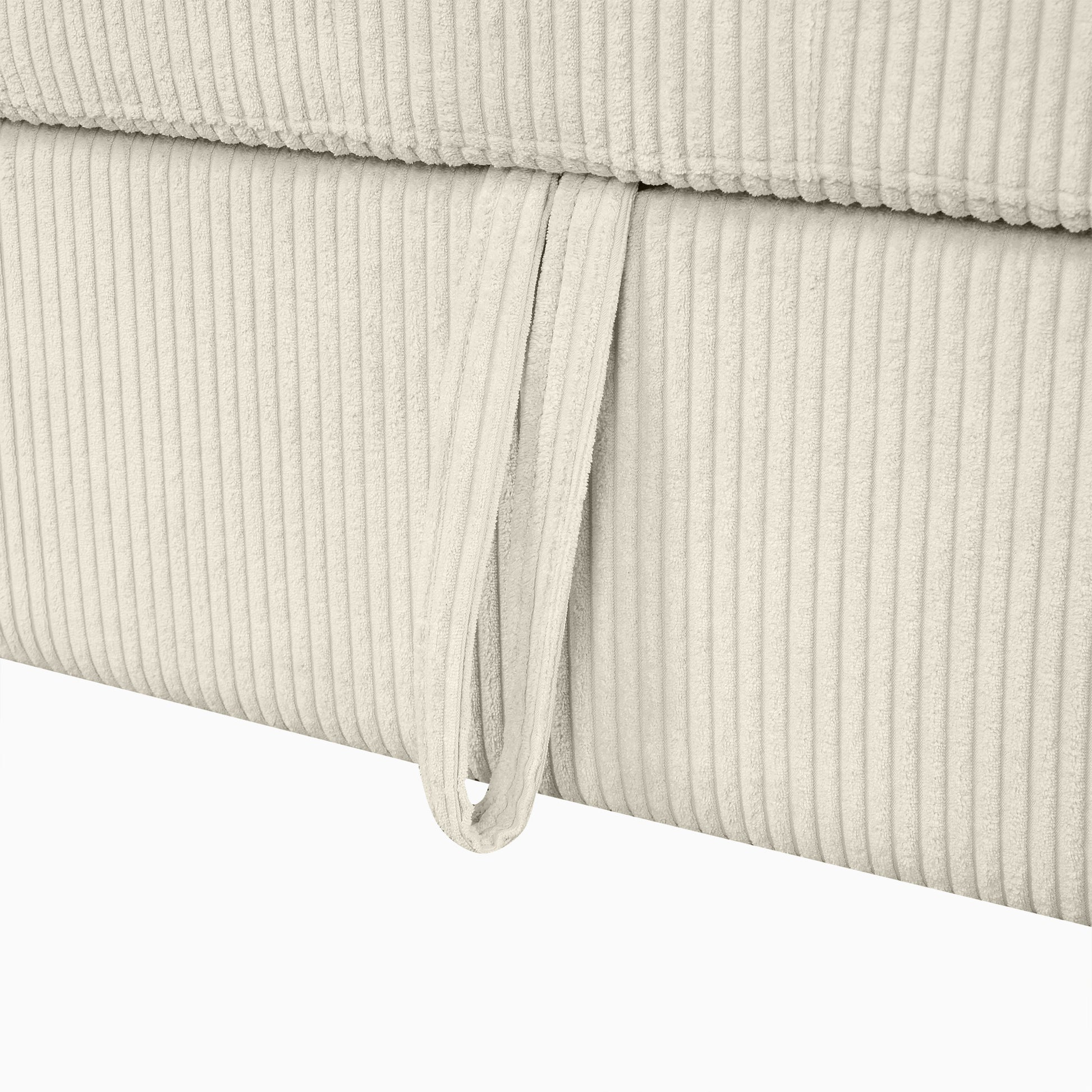 Cream corduroy fabric detail with a looped handle