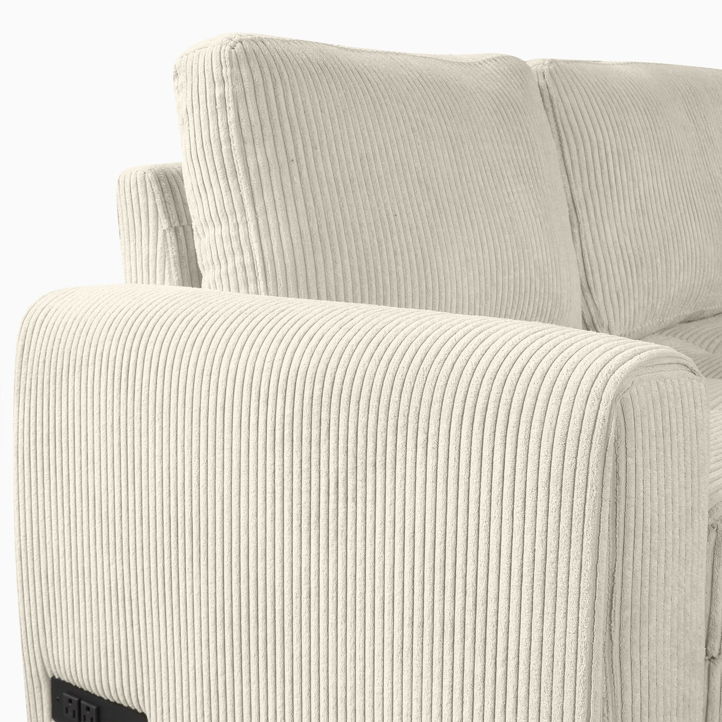 Closeup of a cream corduroy sofa armrest with plush texture and subtle stitching
