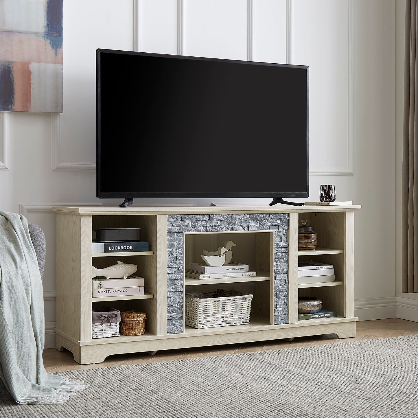 Light oak TV stand with faux stone fireplace detail and ample shelving for media storage