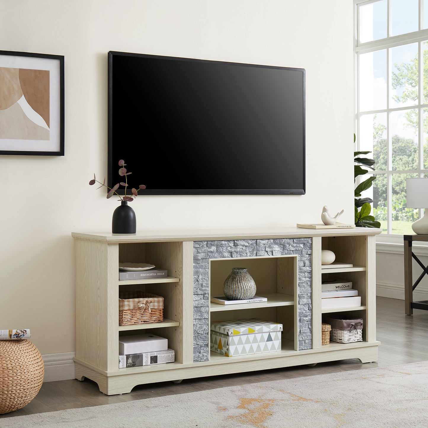 Light oak entertainment center with gray stone accents and open shelving