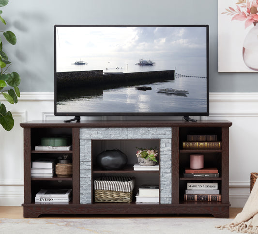 Dark wood TV stand with faux stone fireplace detail and open shelving displaying books and decor