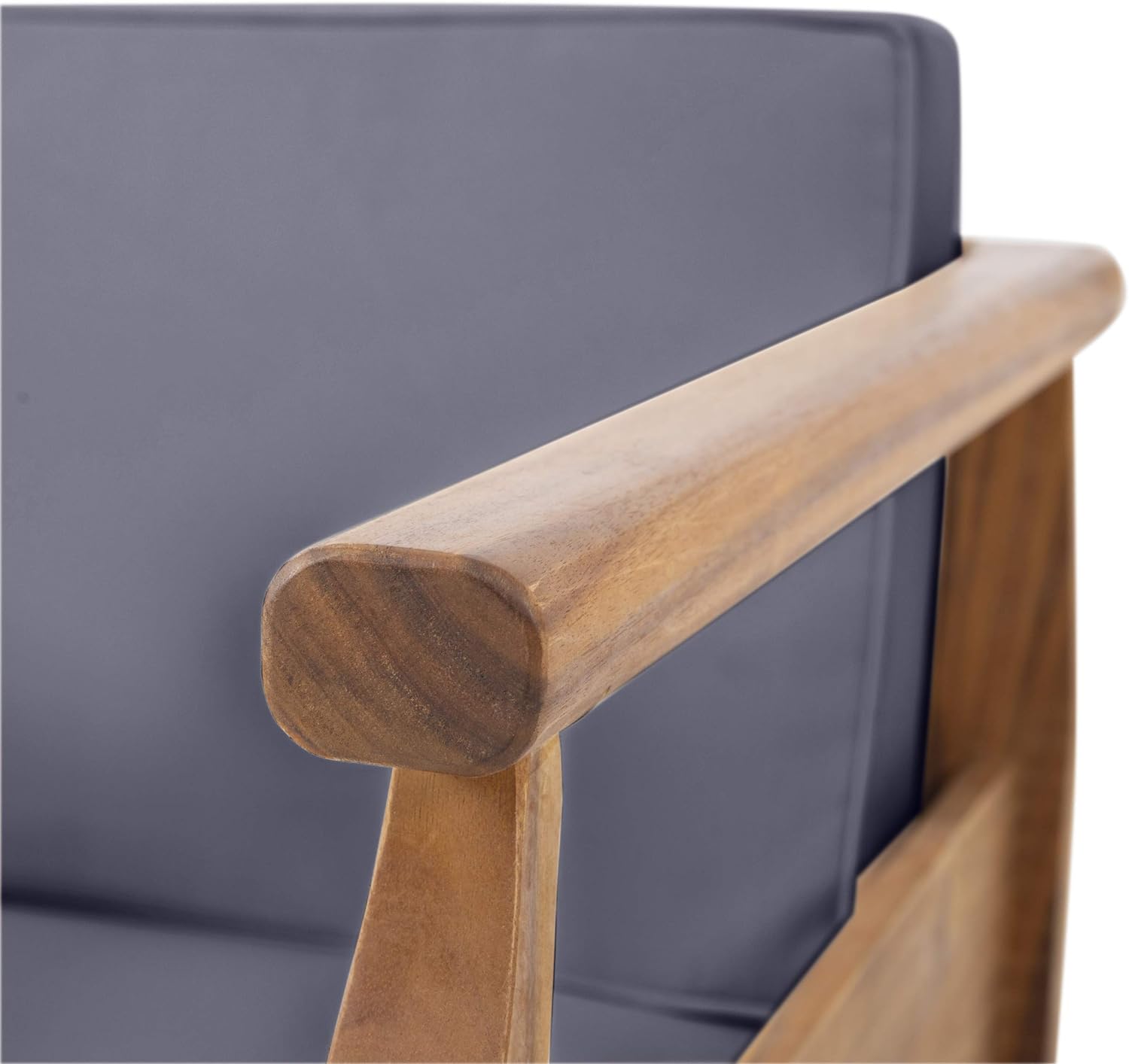 Closeup of rounded wooden armrest on a grey upholstered accent chair