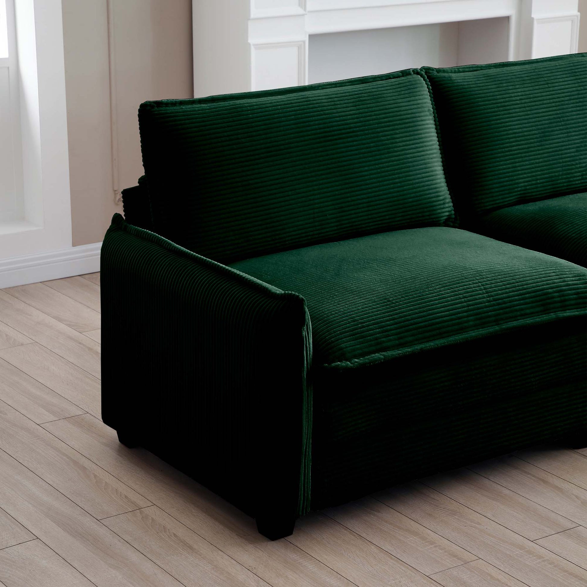 Deep green corduroy sectional sofa plush cushions with textured fabric