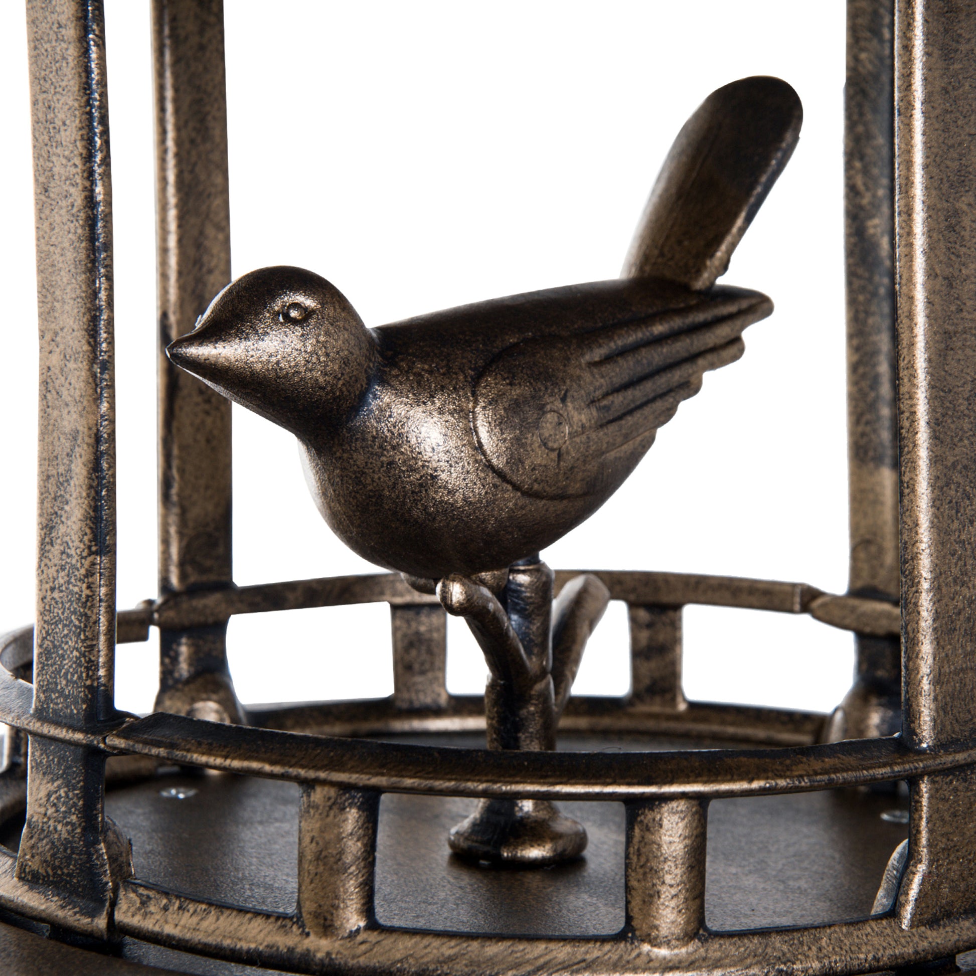 Bronze bird ornament perched on a stand within a decorative cage