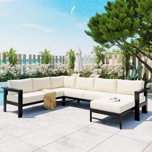 Ushaped sectional outdoor sofa with cream cushions and black frame perfect for patio gatherings