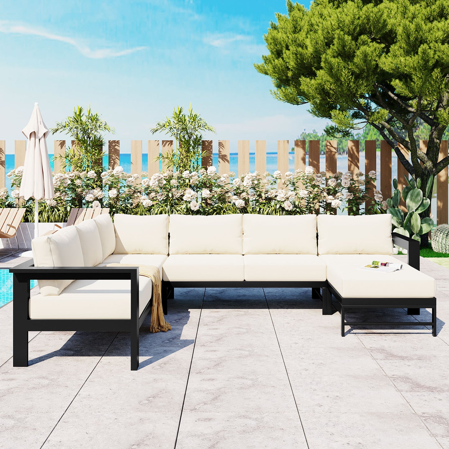 Large cream sectional outdoor sofa with black metal frame and plush cushions