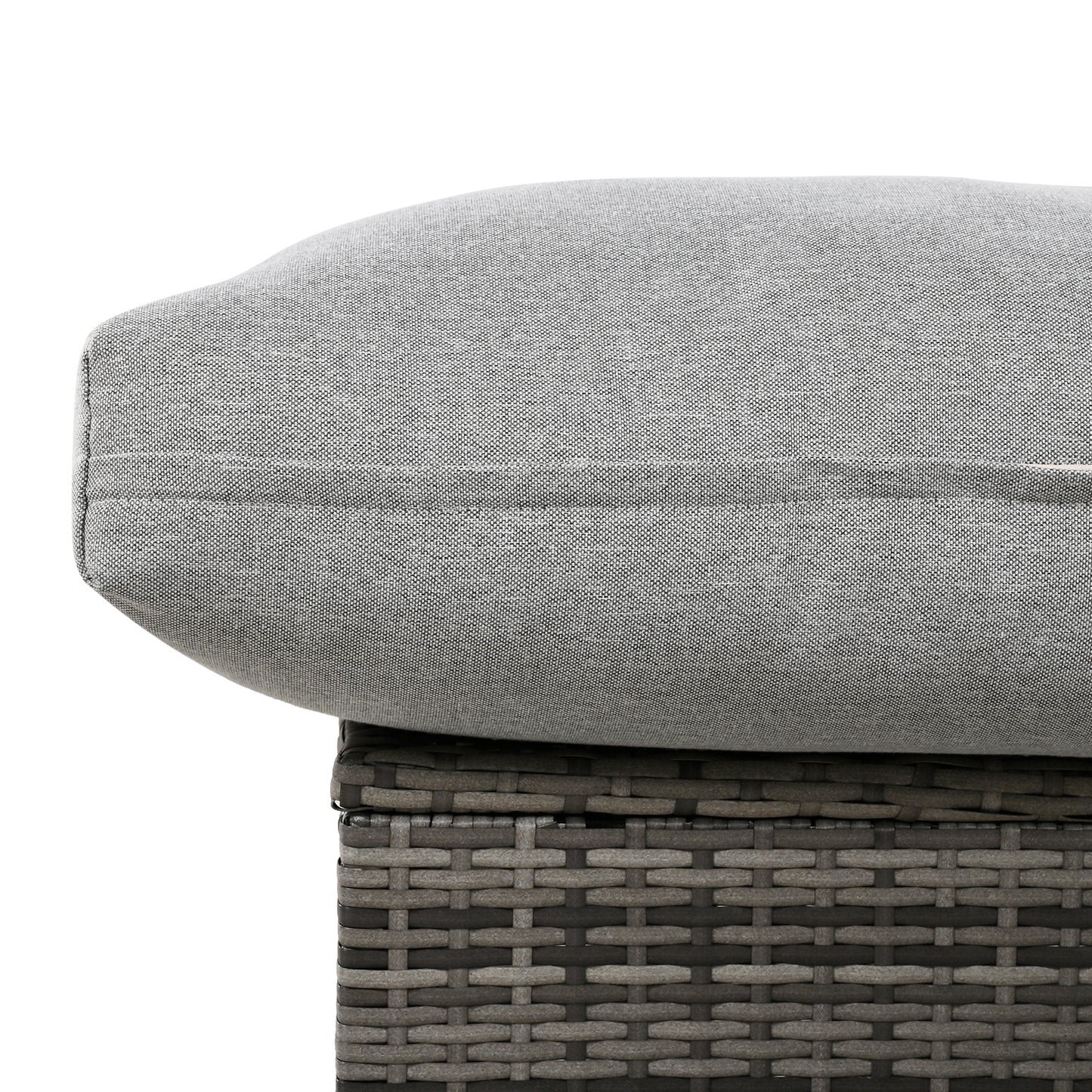 Grey linen outdoor cushion on wicker furniture detail