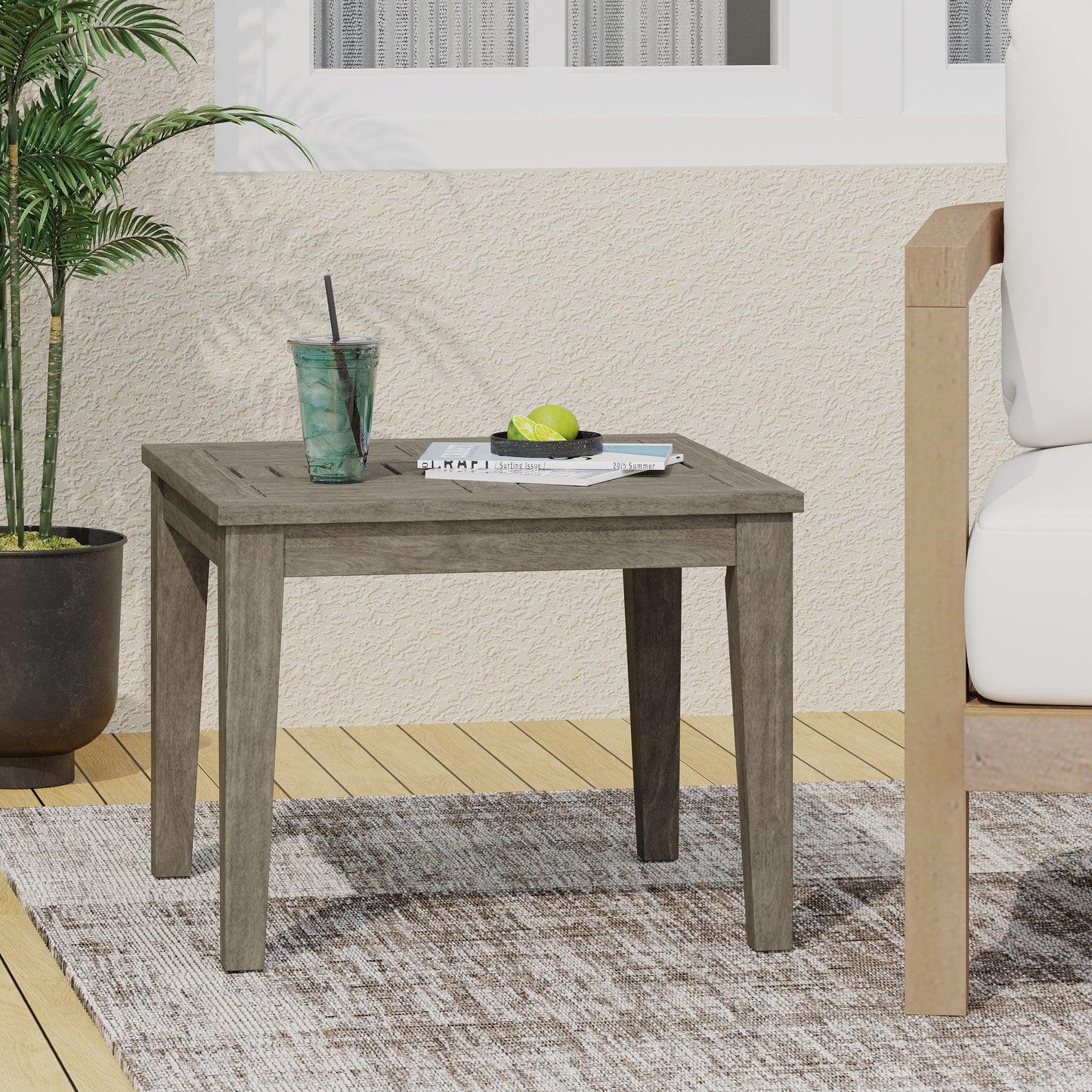 Weathered gray wood patio side table with slatted top perfect for outdoor relaxation
