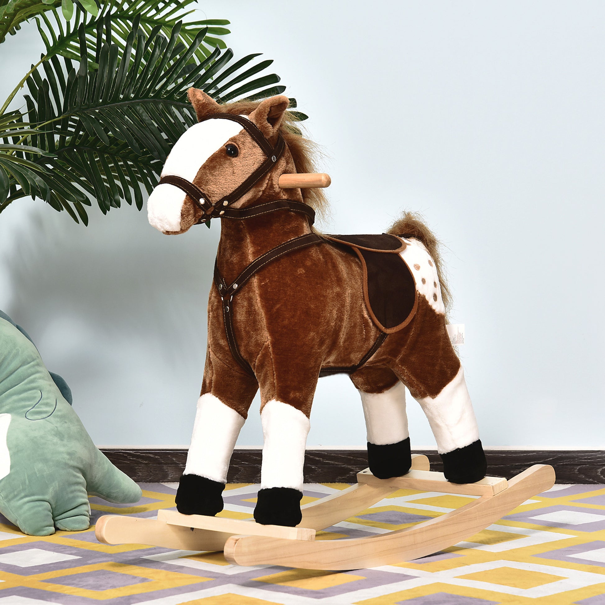 Brown plush rocking horse with white legs and spotted flank on wooden rockers