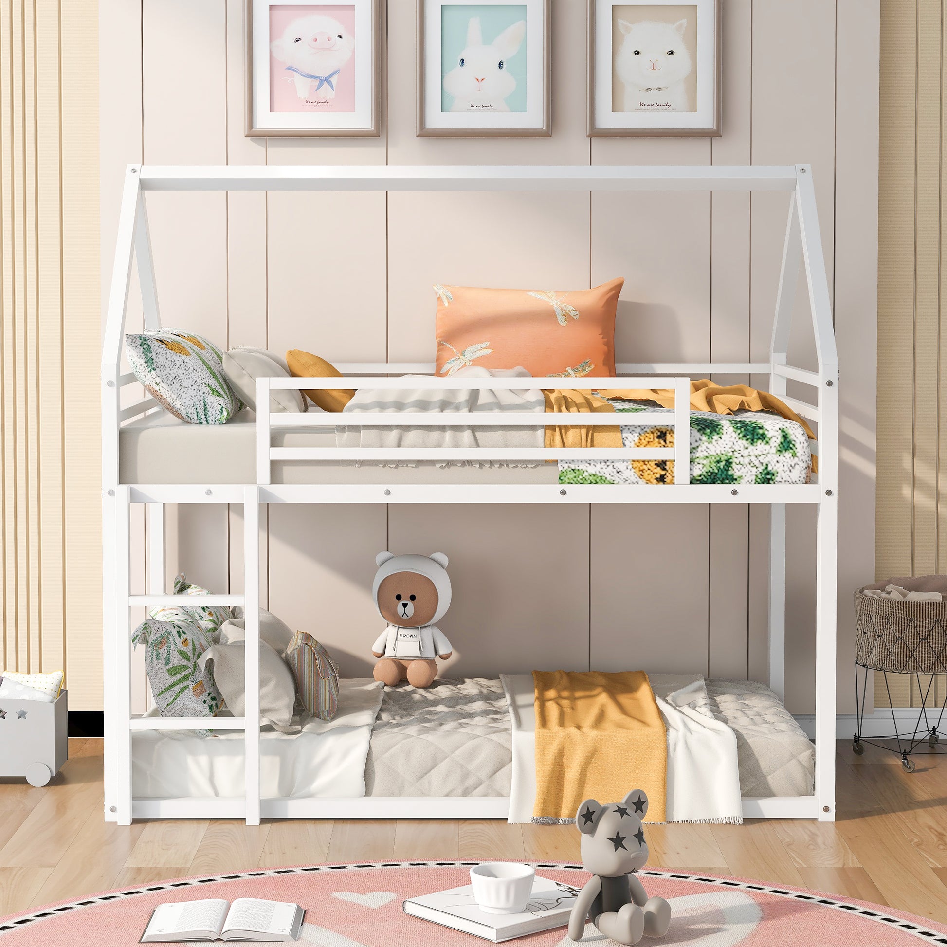 White wooden twin over twin bunk bed with colorful bedding and stuffed animals