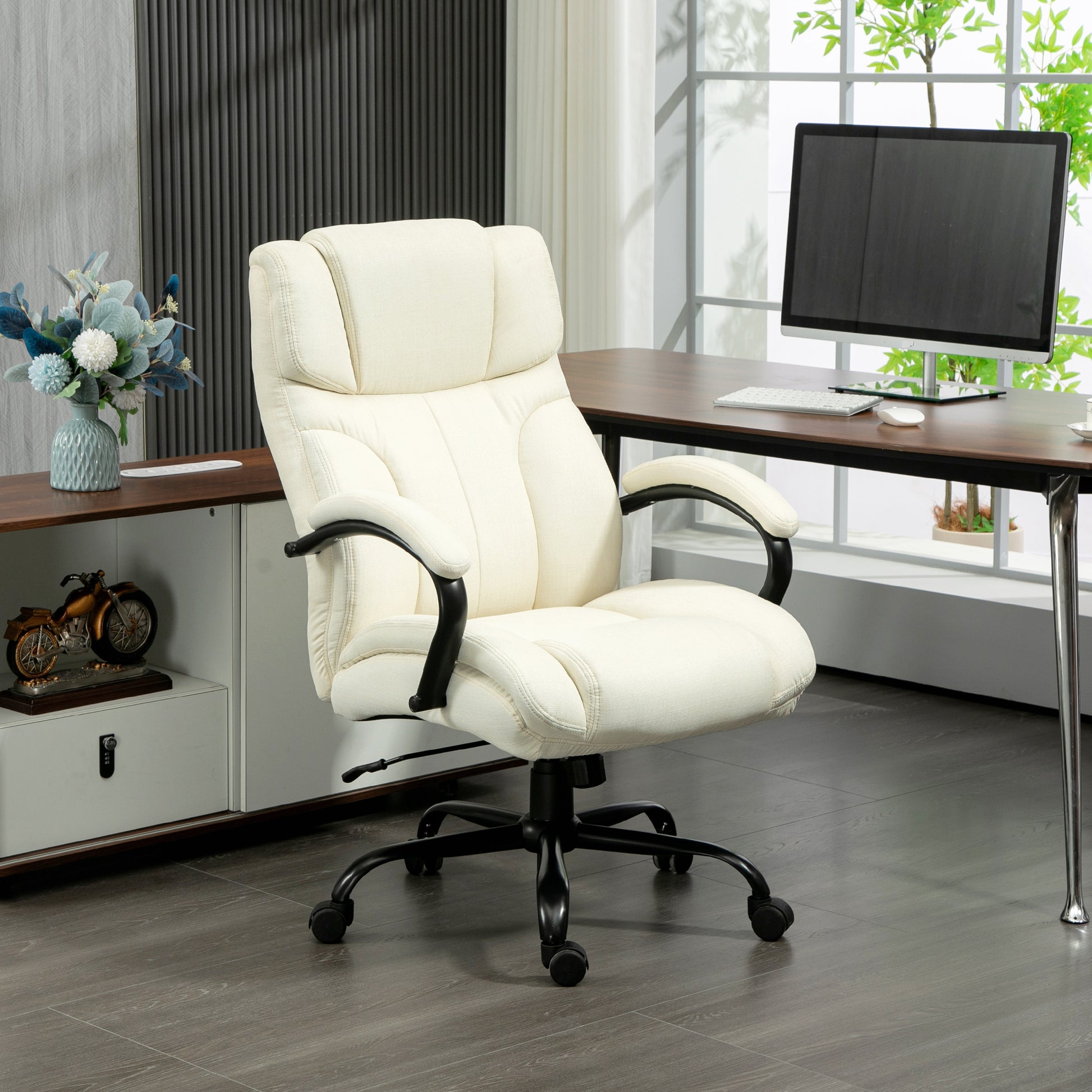Cream fabric office chair with plush padding and black armrests ideal for home office comfort