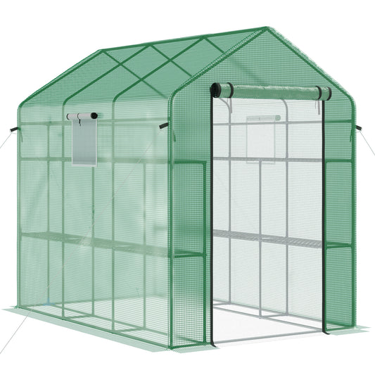 Green portable greenhouse with rollup door and multiple shelves for backyard gardening