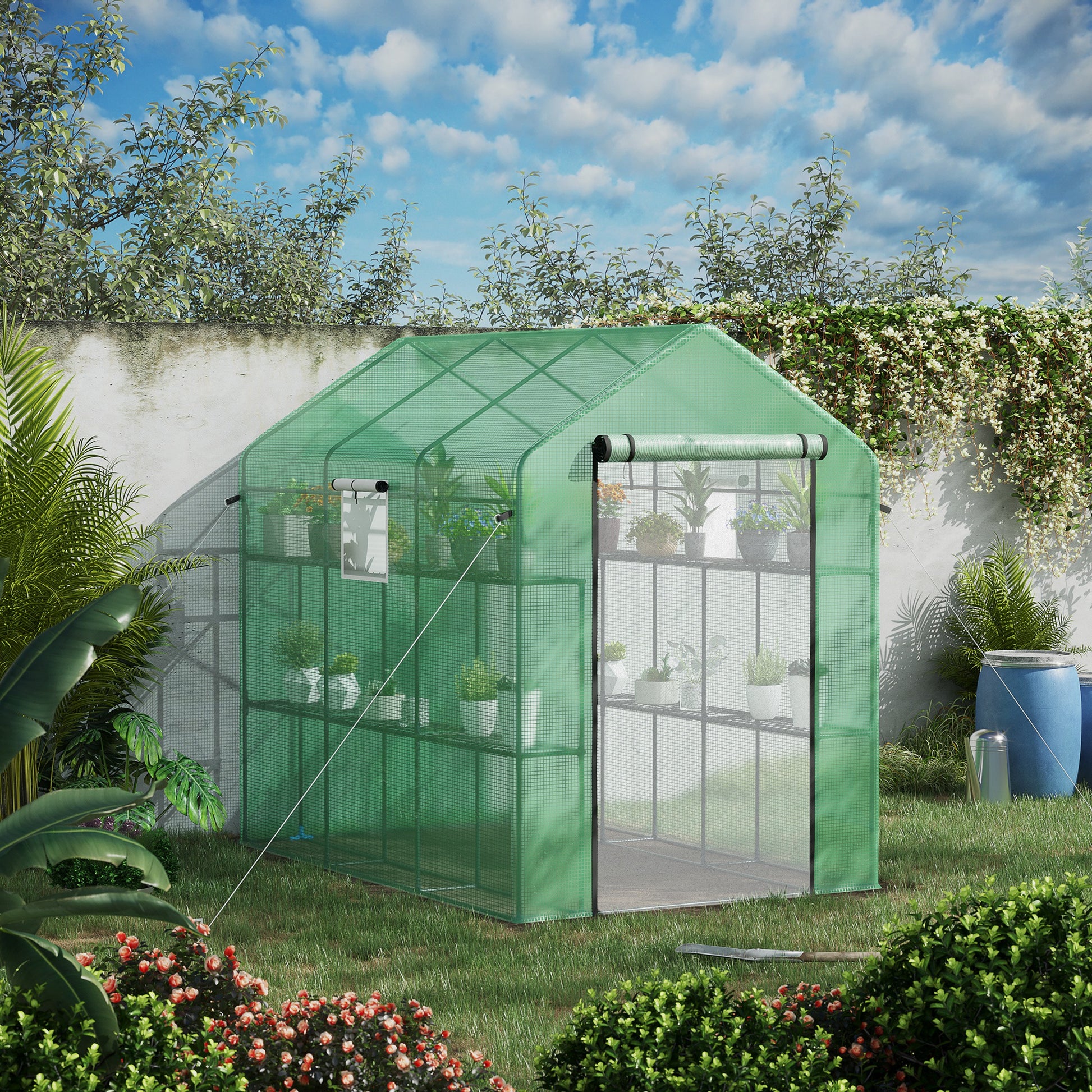 Green mesh greenhouse with tiered shelving perfect for backyard gardening Holds potted plants