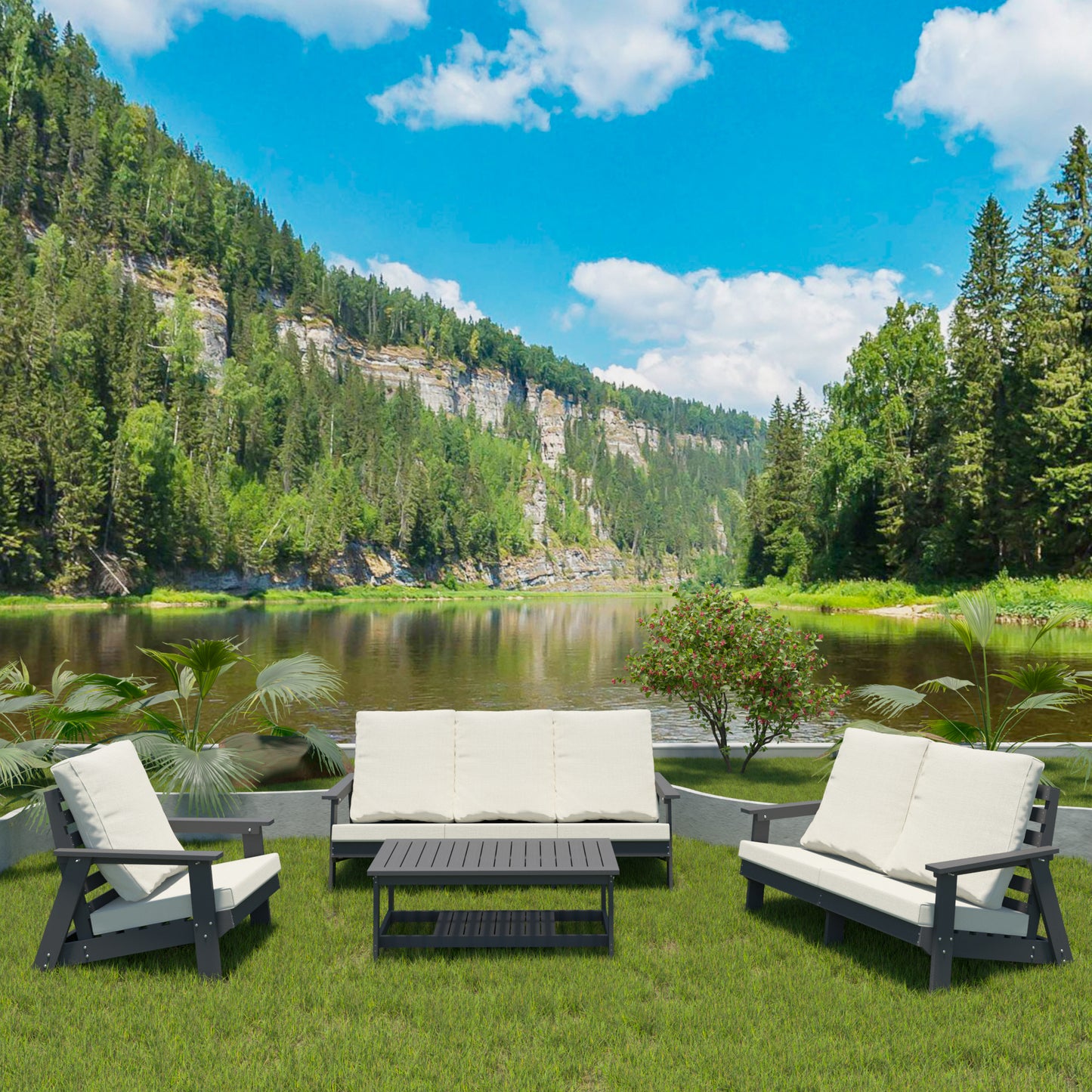 Dark gray modern patio sofa with cream cushions on lush green grass