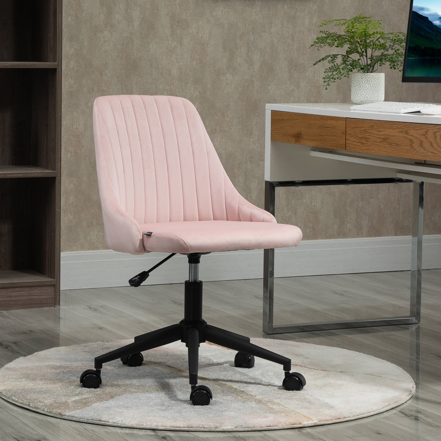 Pink velvet task chair with channel tufting and black base on wheels
